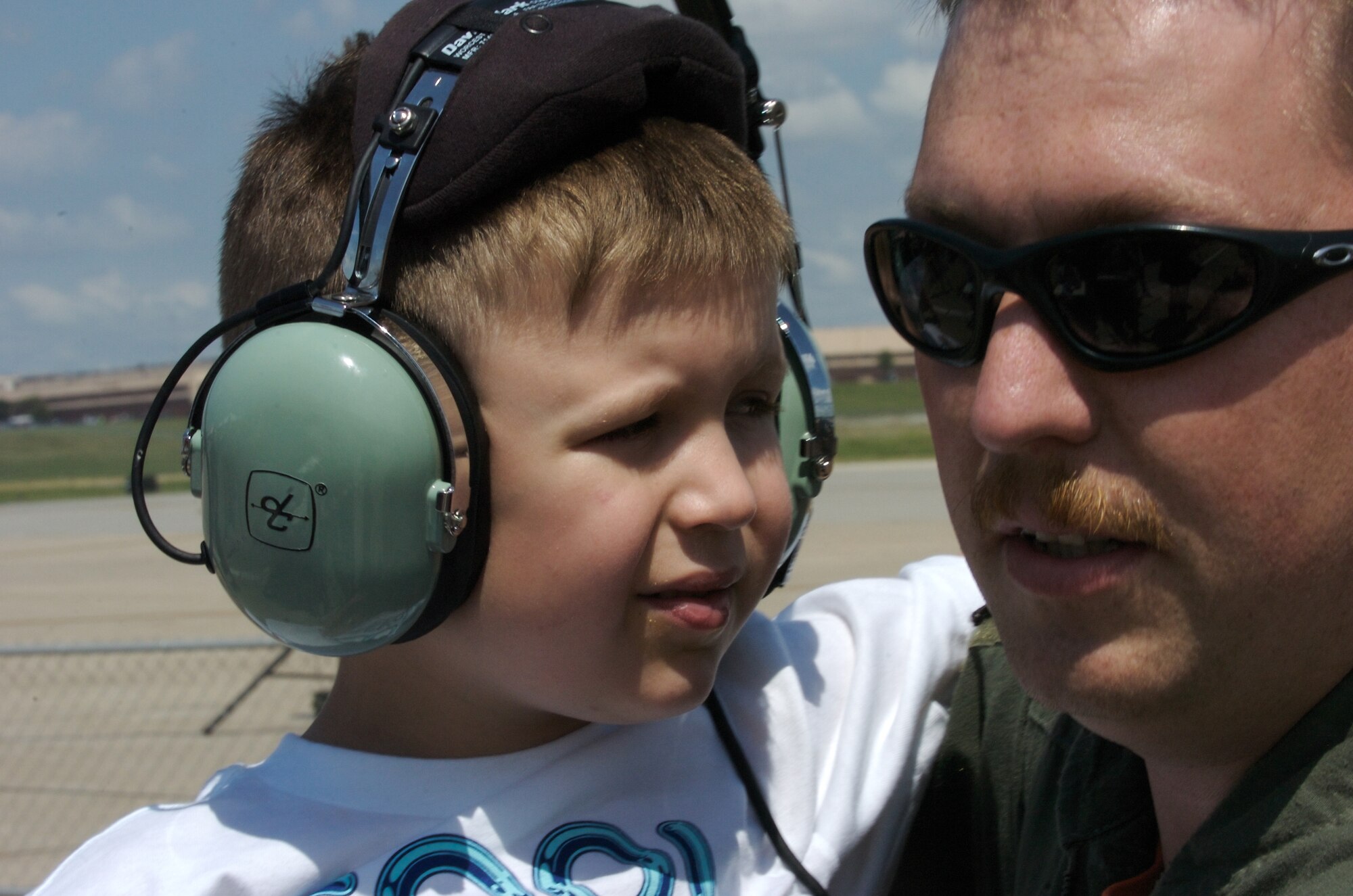 Noah and his father, Staff Sgt. Ken Hindman, spend the day at the special needs airshow Aug. 15 at Offutt Air Force Base, Neb. Sergeant Hindman is assigned to the 338th Combat Training Squadron at Offutt AFB. (U.S. Air Force photo/Lance Cheung)