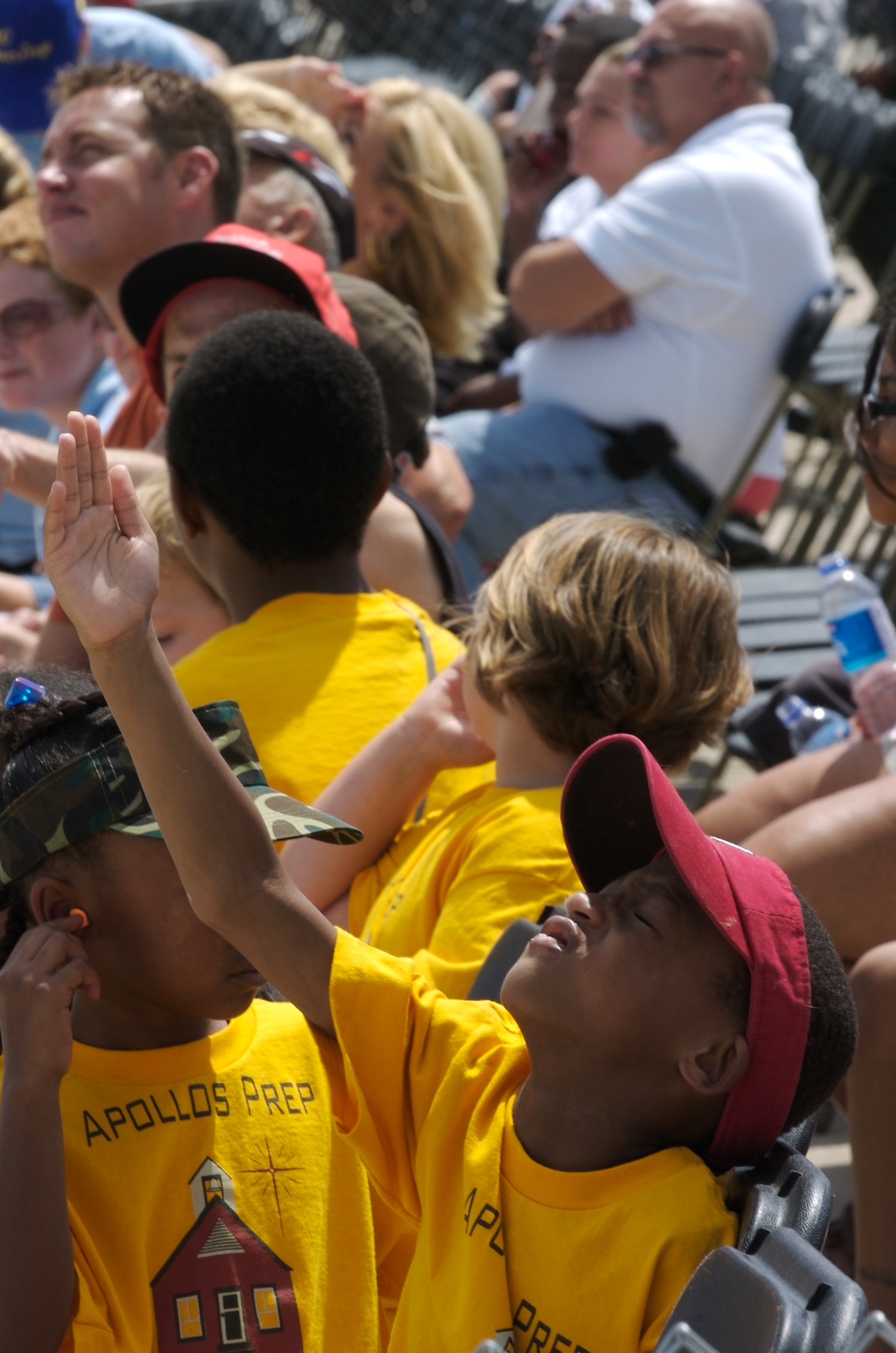 Children and special needs visitors watch a complete airshow Aug. 15 at Offutt Air Force Base, Neb. (U.S. Air Force photo/Lance Cheung)