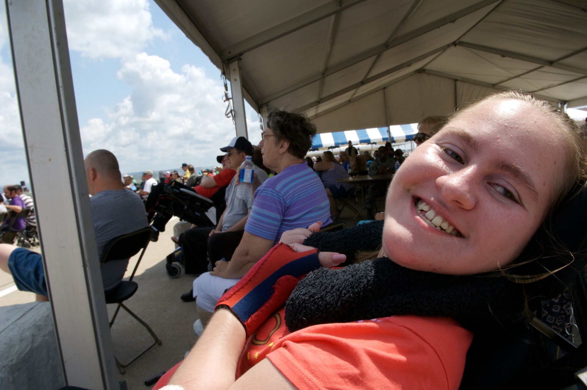 Ashley Ferguson and other special needs visitors watch a complete airshow Aug. 15 at Offutt Air Force Base, Neb.  (U.S. Air Force photo/Lance Cheung)