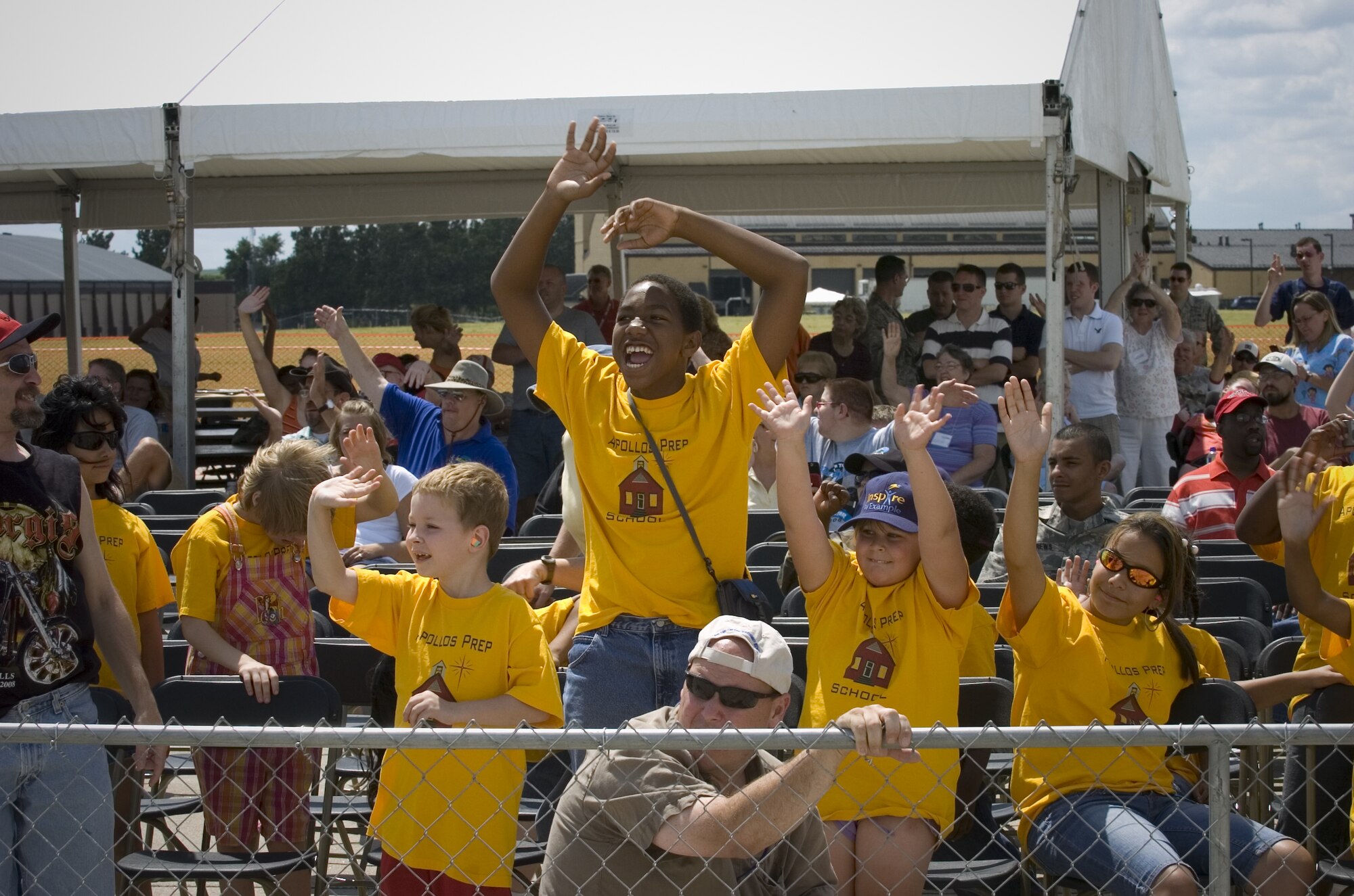 Children and special needs visitors watch a complete airshow that featured the U.S. Air Force Demonstration Squadron "Thunderbirds" Aug. 15 at Offutt Air Force Base, Neb. (U.S. Air Force photo/Lance Cheung)
