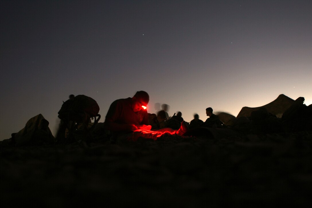 A Marine with Company F, Battalion Landing Team 2/5, 15th Marine Expeditionary Unit, rests after a day of training during the bi-lateral training exercise Infinite Moonlight in the Jordanian desert.