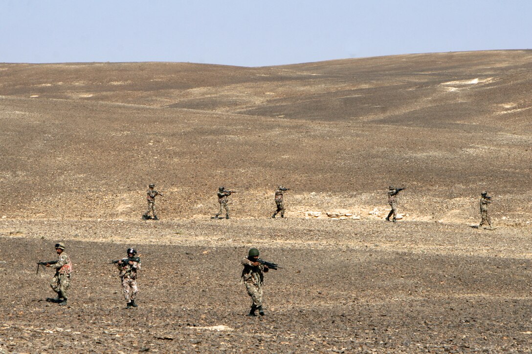 Jordanian soldiers conduct a security patrol during the bi-lateral training exercise "Infinite Moonlight" in the Jordanian desert.::r::::n::   Infinite Moonlight, a two-week exercise conducted by the U.S. military and the Jordanian Army, is designed to share tactical knowledge and build on the military ties between the United States and Jordan.::r::::n::   The Camp Pendleton, Calif. based 15th MEU is comprised of approximately 2,200 Marines and Sailors and is a forward deployed force of readiness capable of conducting numerous operations, such as Non-Combatant Evacuation Operations, Humanitarian Assistance Operations and a wide range of amphibious missions. ::r::::n::   The 15th MEU is currently conducting sustainment training in the desert of Jordan. (Official USMC photo by Cpl. Timothy T. Parish) (Released)::r::::n::