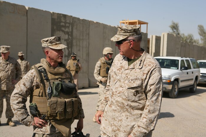 The Commandant of the Marine Corps visited Camp Fallujah Aug. 16 to discuss progress being made in Iraq. During his visit General James T. Conway spoke with Col. Lewis A. Craparotta, commanding officer, Regimental Combat Team 1, about security in the region and traveled to Ramadi to meet with members of the Iraqi Army and Police.