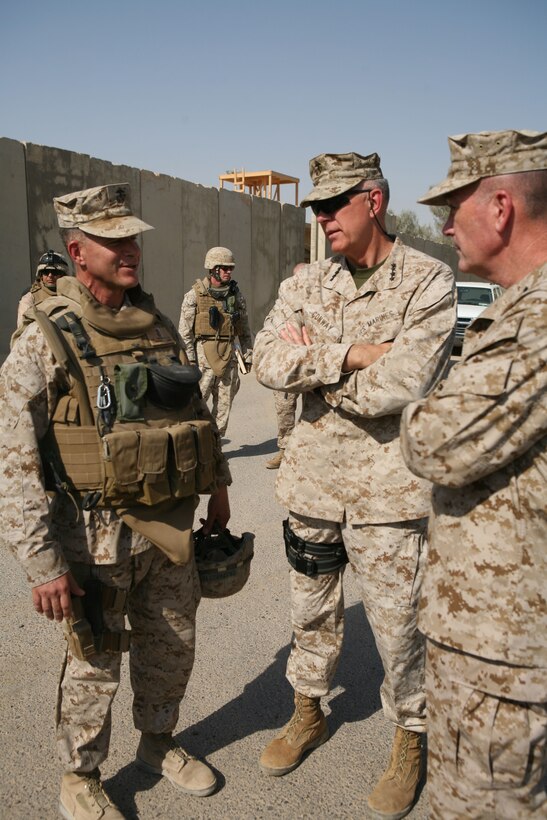 General James T. Conway, Commandant of the Marine Corps, spoke with Col. Lewis A. Craparotta, commanding officer, Regimental Combat Team 1, at Camp Fallujah, Iraq, during a survey of progress in Iraq Aug. 16. Conway also spoke with several Marines at the Chapel of Hope aboard the camp to address current issues taking place in the al Anbar region (Official Marine Corps photo by Cpl. Chris T. Mann)