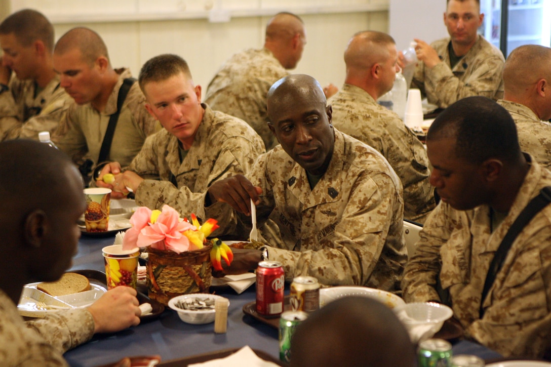 Sgt. Maj. Carlton W. Kent, Sergeant Major of the Marine Corps, talks with Marines at the Camp Baharia Mess Hall Aug. 16. Sgt. Maj. Kent and Commandant of the Marine Corps Gen. James T. Conway, visited with Marines in the al Anbar Province during a tour of Iraq and Afghanistan.