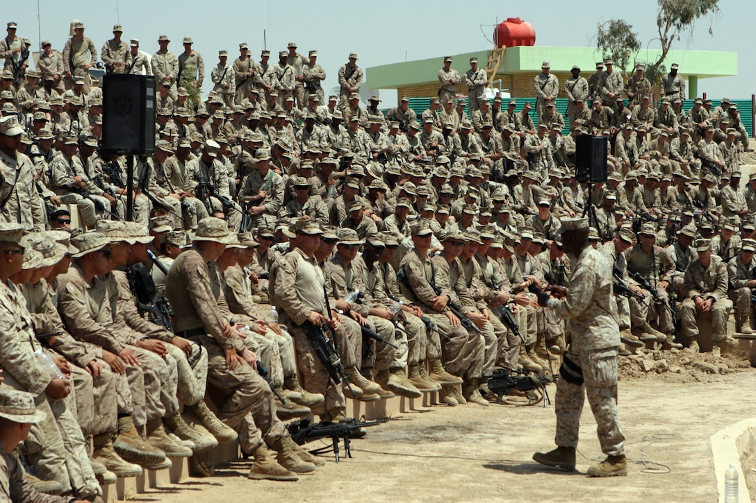 During a trip to Camp Baharia in Iraq Aug. 16, Sgt. Maj. Carlton W. Kent, Sergeant Major of the Marine Corps, speaks to Marines of 1st Battalion, 3rd Marine Regiment; 2nd Bn., 3rd Marines; and 3rd Bn., 6th Marines, all elements of Regimental Combat Team 1.