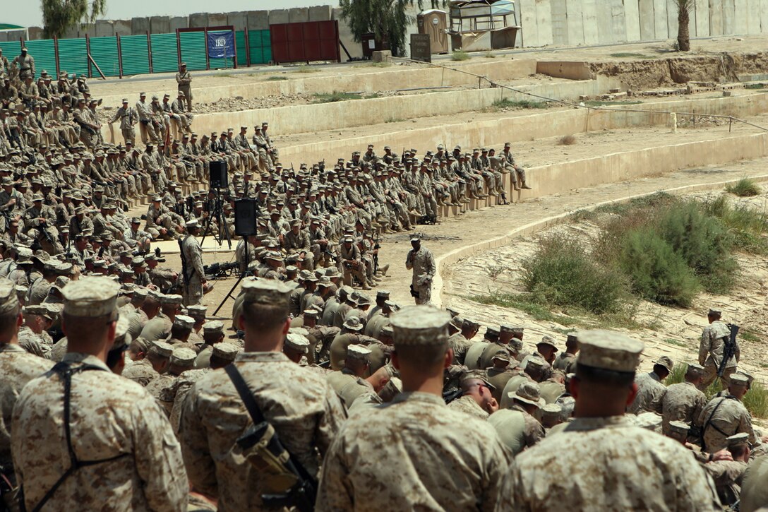 Marines of 1st Battalion, 3rd Marine Regiment; 2nd Bn., 3rd Marines; and 3rd Bn., 6th Marines, gathered for a speech given by Sgt. Maj. Carlton W. Kent, Sergeant Major of the Marine Corps, aboard Camp Baharia in Iraq Aug. 16.