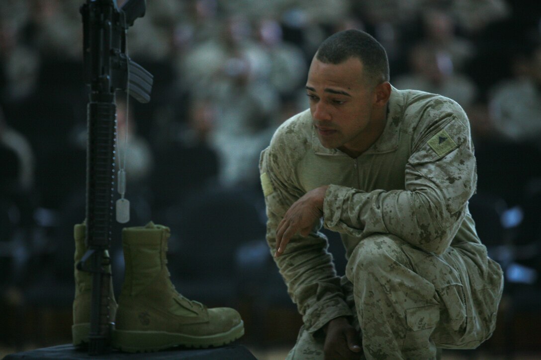 CAMP FALLUJAH, Iraq (August 16, 2008) Marines with Maintenance Company, Combat Logistics Battalion 1, 1st Marine Logistics Group, came to pay their final respects to Cpls. Adam T. McKiski and Stewart S. Trejo during a memorial service Aug. 16. (Photo by Cpl. Tyler B. Barstow)