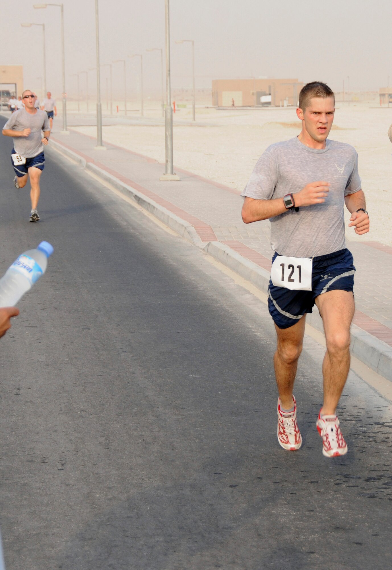 Capt. Michael Lilly, Combined Air and Space Operations Center finishes strong in the “Run for the Fallen 5K” sponsored by the 379th Expeditionary Force Support Squadron Sunday, Aug. 17, 2008, at an undisclosed air base in Southwest Asia.  183 runners from the Army, Navy, Air Force and Marines as well as coalition partners participated in the run honoring those who have made the ultimate sacrifice in the Global War on Terrorism. (U.S. Air Force photo by Tech. Sgt. Michael Boquette/Released)