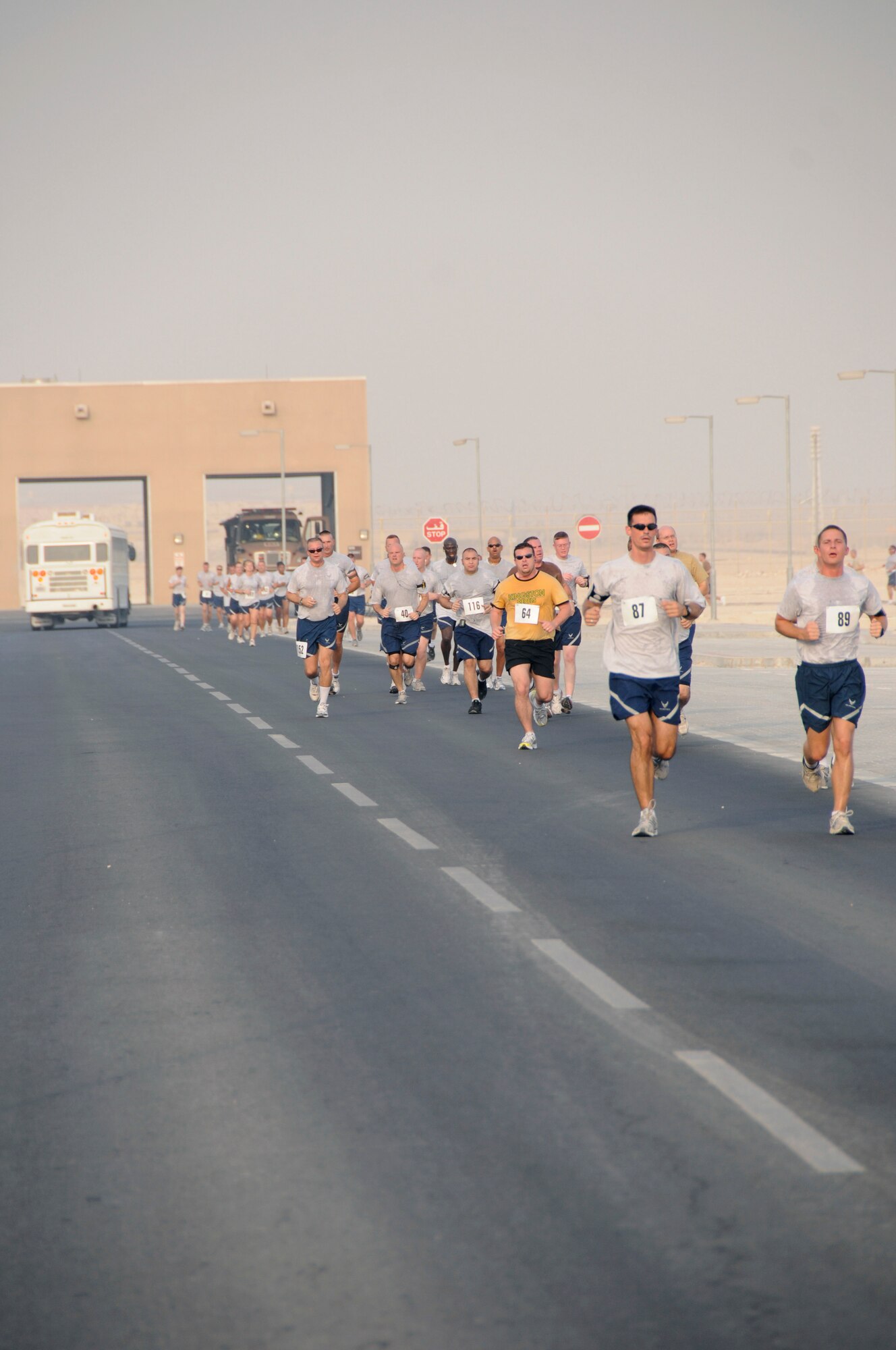 Runners endure suffocating heat and humidity in the “Run for the Fallen 5K” sponsored by the 379th Expeditionary Force Support Squadron Sunday, Aug. 17, 2008, at an undisclosed air base in Southwest Asia.  183 runners from the Army, Navy, Air Force and Marines as well as coalition partners participated in the run honoring those who have made the ultimate sacrifice in the Global War on Terrorism. (U.S. Air Force photo by Tech. Sgt. Michael Boquette/Released)
