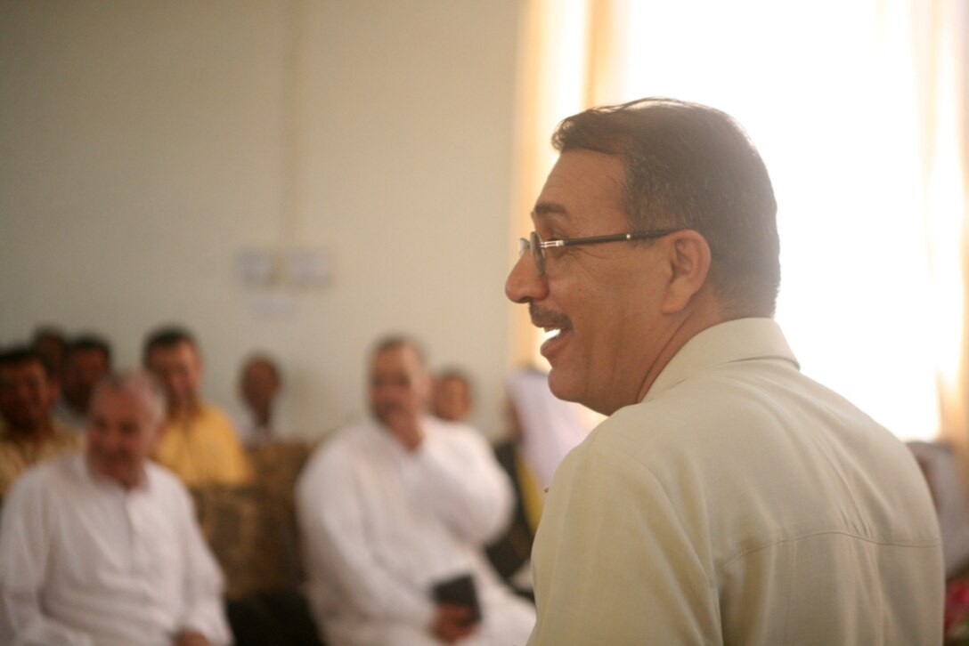 Waleed Hameed Salaiman, a senior trainer from Fallujah, Iraq, discusses governmental structure types with local leaders during a government training class in Rutbah, Iraq, Aug. 18. The classes were started in December 2007 to ensure the new Rutbah government officials are ready to head a well-structured city council.::r::::n::