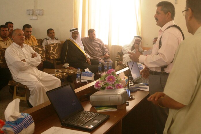 Greeting city leaders before a government training class Feb. 18, Qasim Marai Awad, mayor of Rutbah, Iraq, expresses his gratitude for the hard work in improving the  infrastructure of western Al Anbar province. The classes were started in December 2007 to ensure the new Rutbah government officials are best equipped to head a well-structured city council.::r::::n::