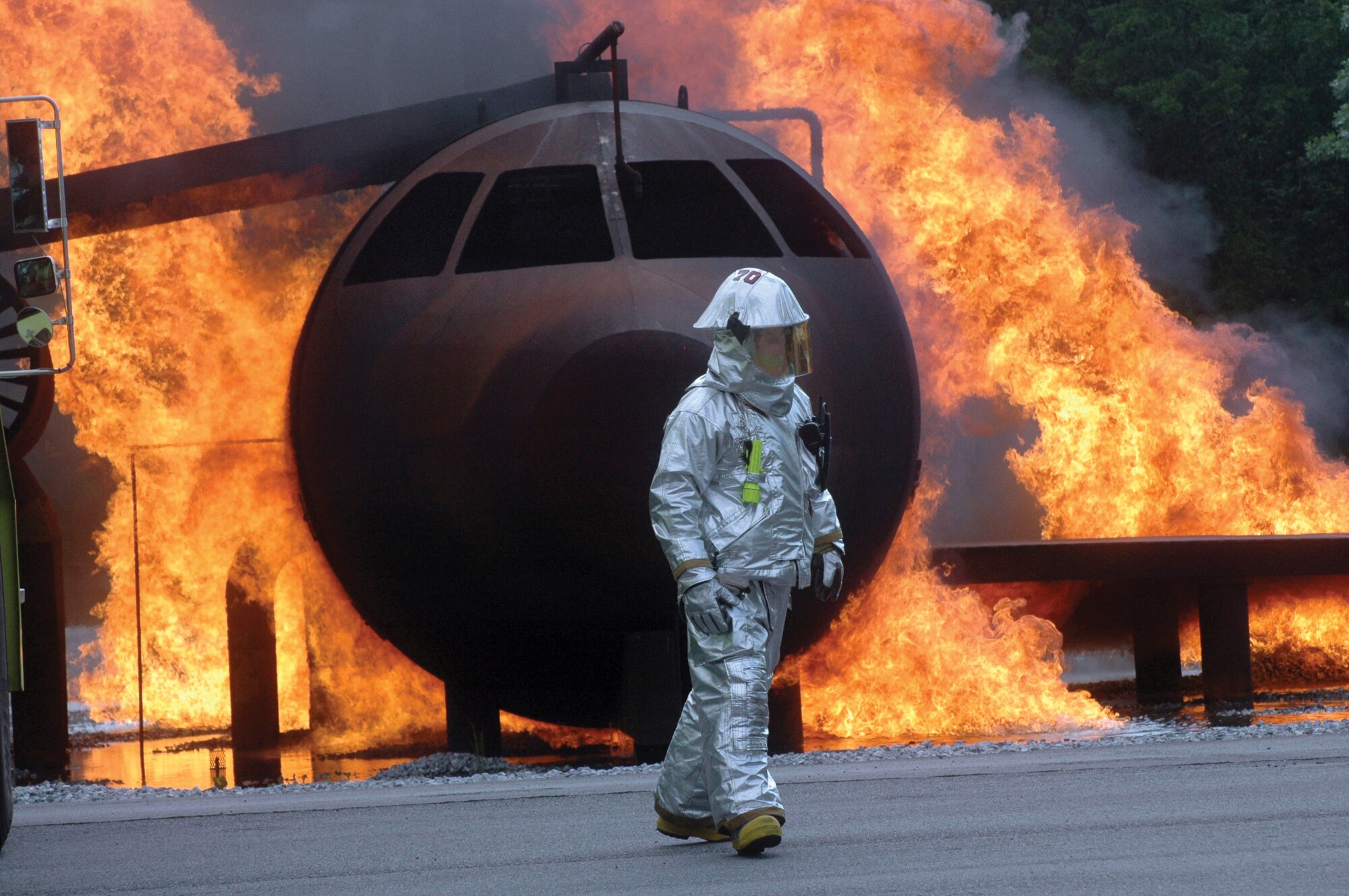 Eric Danforth, Robins Fire Dept walks in front of the aircraft model in the fire training pit. Members of the Robins and Macon Bibb County fire departments worked side by side in a two-day joint exercise sharing knowledge and experience in an effort to become better trained for a real emergency.U. S. Air Force photo by Sue Sapp