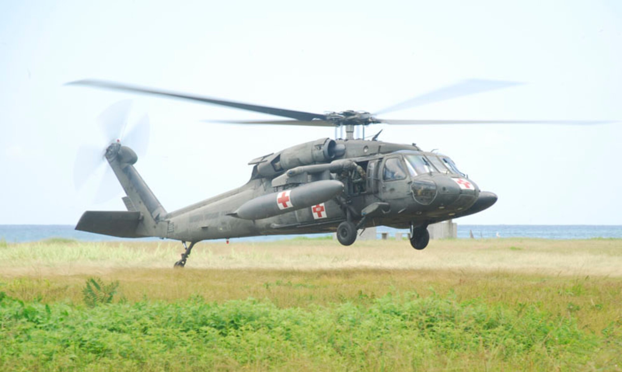 PUERTO CASTILLA, Honduras - A Blackhawk from the 1-228th U.S. Army Air Ambulance Division lands here Aug. 18 in support of the Paz Garcia Humanitarian Assistance Disaster Response Exercise. More than 120 servicemembers from the United States and Central American countries will participate in the three-day exercise, which will test disaster response. (U.S. Air Force photo by Staff Sgt. Joel Mease)