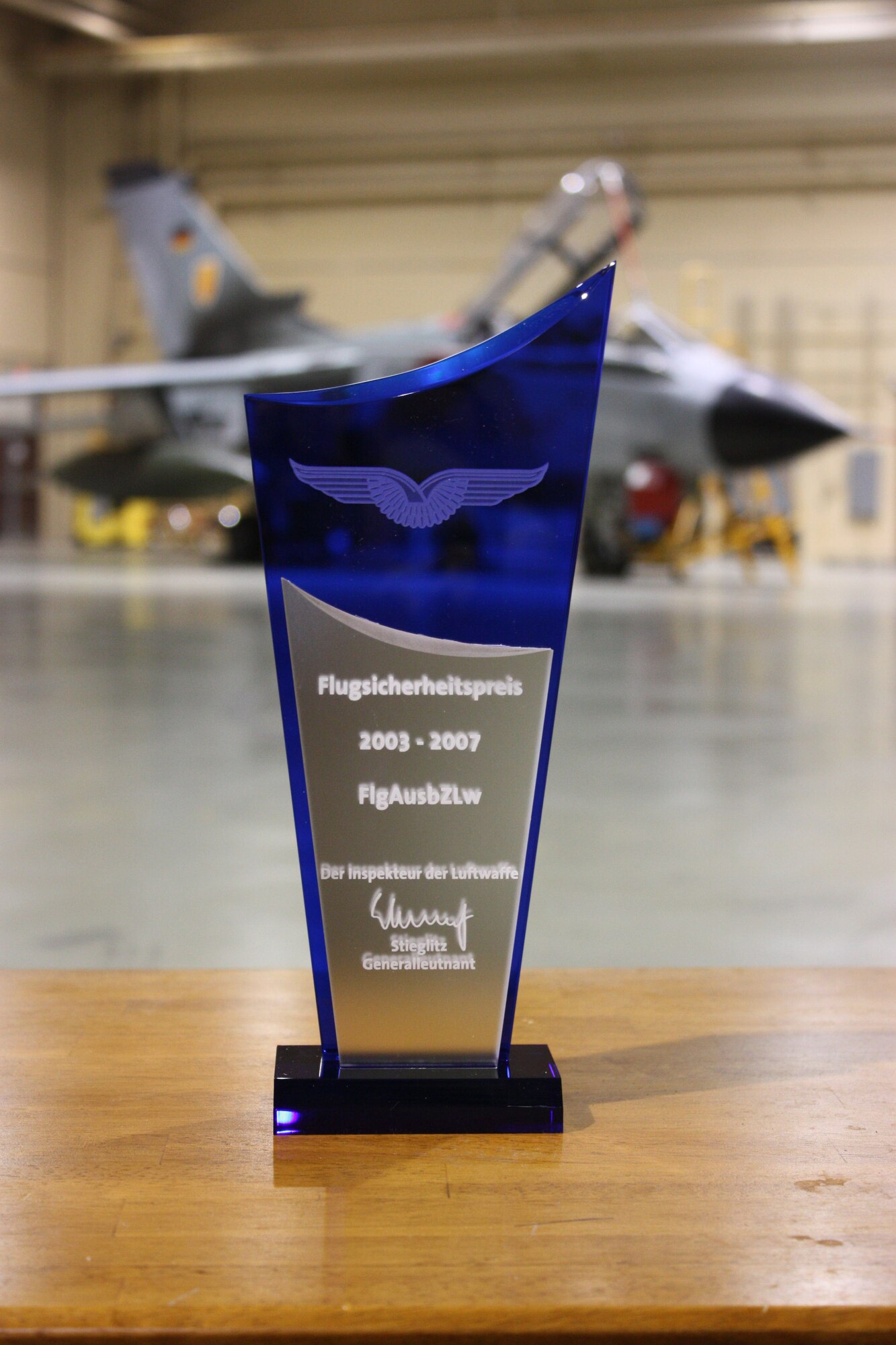 The Flight Safety Cup, which was presented to the German Air Force Flying Training Center for five years with no flight accidents, sits in front of a German Tornado at Holloman Air Force Base, N.M., August 14. The German writing on the cup translates to: Flight Safety Cup, 2003 - 2007, Flying Training Center, The Chief of Staff of the Air Force, Lt. Gen. Stieglitz. (German Air Force photo/Chief Master Sgt. Robert Meintz)