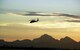 A 920th Rescue Wing HH-60G Pave Hawk helicopter  pierces the desert sky over the mountains in southern Arizona. Air Force Reserve Command aircrews and maintainers from Patrick Air Force Base, Fla., worked day and night July 12-25, 2008, at Davis-Monthan AFB, Ariz., to gain high-altitude experience prior to their upcoming deployment to Afghanistan. The country is known for having the roughest terrain with some of the highest mountains in the world. (U.S. Air Force photo/Capt. Cathleen Snow)