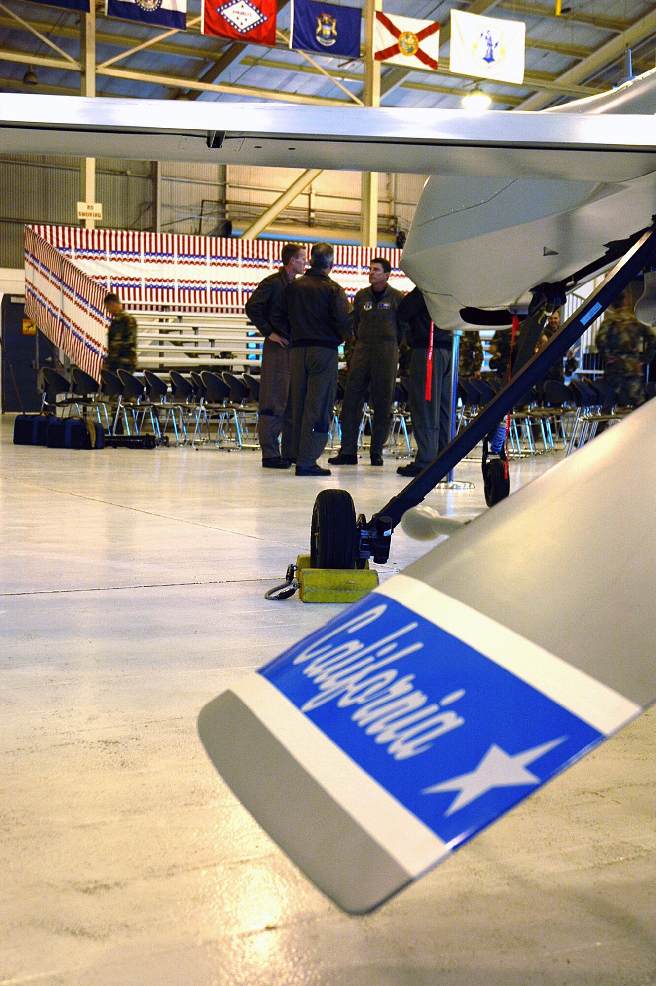 California Air National Guard MQ-1 Predator pilots meet in their hanger at March Air Reserve Base in November 2006 following the activation ceremony for the 196th Reconnaissance Squadron. Today, pilots in the squadron operate three combat air patrols in Iraq from the squadron's base operations center. (U.S. Air Force photo/Master Sgt. Mike R. Smith)