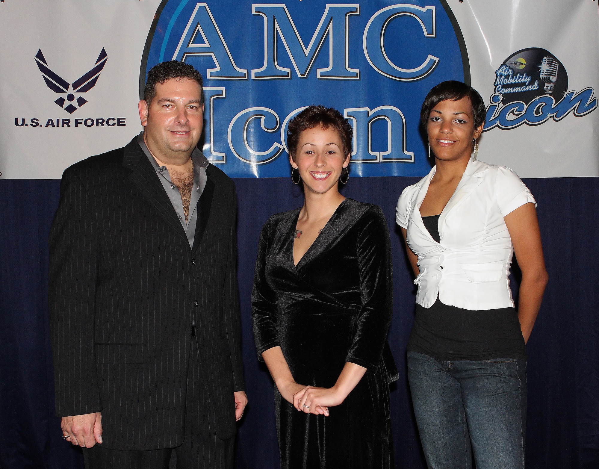 DOVER AIR FORCE BASE, Del. -- (Left to right) Tech. Sgt. Ronald Popio, third place, Airman 1st Class Naomi Nadeau, first place, and Airman 1st Class Christiana Ramirez, second place, were the three top performers during Dover’s Air Mobility Command Icon competition Aug. 13 at The Landings Club. As Dover’s winner, Airman Nadaeu will compete in the AMC-level completion Oct. 23 for a chance to win $1,000. (U.S. Air Force photo/Roland Balik)