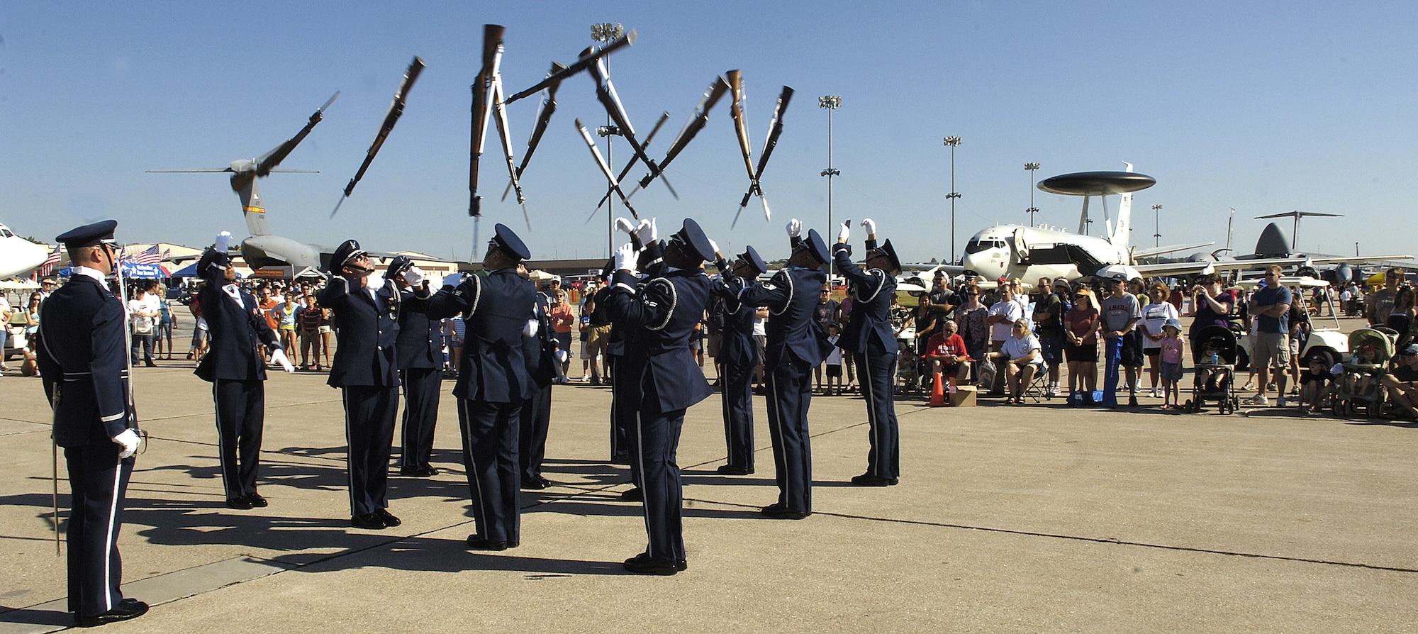 The U.S. Air Force Honor Guard Drill Team performs during an air show Aug. 15 at Offutt Air Force Base, Neb., presented in celebration of Air Force Week in Omaha, Neb. The drill team is the traveling component of the Honor Guard and tours worldwide representing all Airmen while showcasing Air Force precision. (U.S. Air Force photo by Senior Airman Dan DeCook)