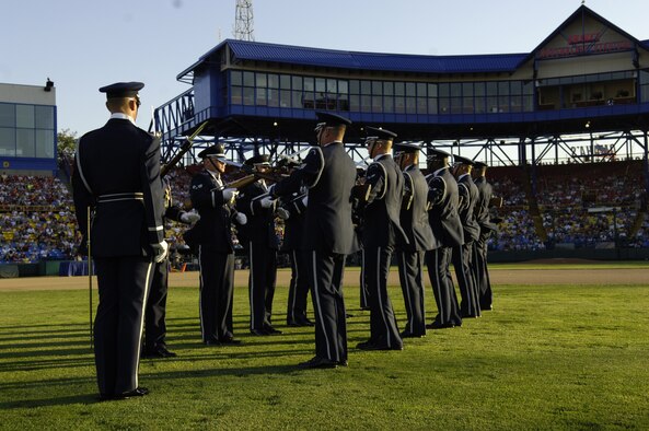 The U.S. Air Force Honor Guard Drill Team performs their 12-man routine during opening ceremonies at Air Force Week in Omaha, Neb., Aug. 9 at Rosenblatt Stadium, home of the College World Series. The drill team is the traveling component of the Honor Guard and tours worldwide representing all Airmen while showcasing Air Force precision. (U.S. Air Force photo by Senior Airman Dan DeCook)