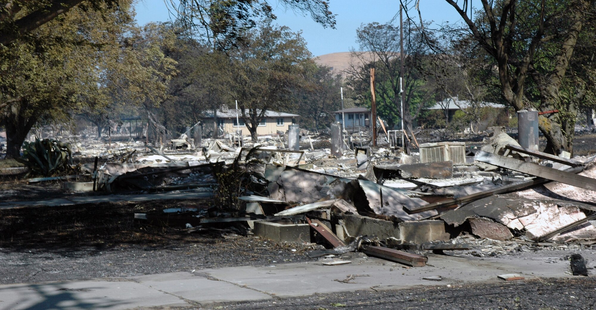 An eight-alarm fire destroyed 167 unoccupied housing units and damaged 11 more Aug. 16 at Travis Air Force Base, Calif. Travis AFB emergency personnel, with help from local firefighting and police agencies, contained the fire before it spread to any occupied housing on the base. The destroyed and damaged units were awaiting demolition. (U.S. Air Force photo/Senior Airman Shaun Emery)

