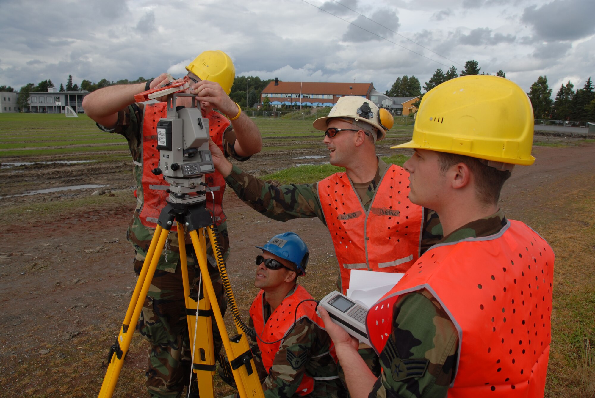 August 11, 2008 Rygge, Air Force Base, Norway- 

SrA Ryan Savage, SSgt Mike Jarabek, SSgt Craig Beedle, and SrA Sean Binghan set up surveying equipment in order to stake out precise boundaries prior to the construction of a soccer field in Rygge Air Force Base, Norway. The Airmen are members of the Iowa Air National Guard, 185th Air Refueling Wing, Civil Engineering Squadron (CE), Site Development, in Sioux City, Iowa. These 185th unit members are deployed to Norway in support of Operation Impeccable Glove 2008. The engineering mission is a joint effort with the, Army Cadets, from the Norwegian Military Academy.

Official Air Force Photo By: SSgt. Oscar M. Sanchez-Alvarez
