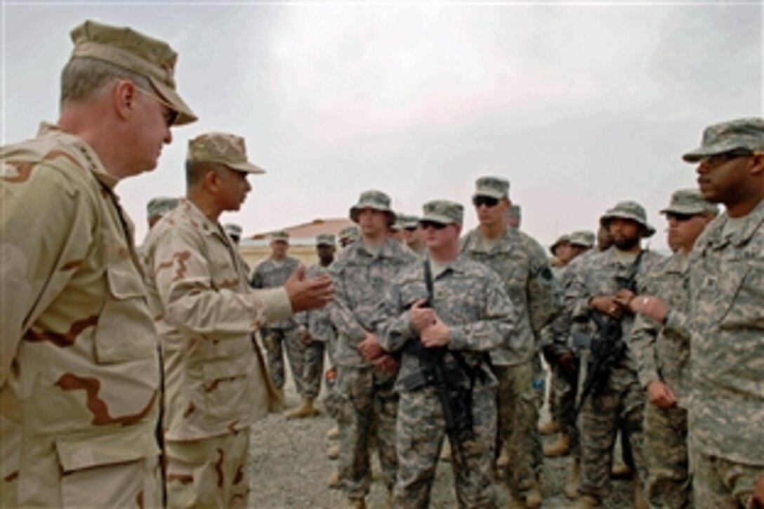 Chief of Naval Operations Adm. Gary Roughead, left, and Master Chief Petty Officer of the Navy Joe R. Campa Jr. speak with sailors, Marines and soldiers during an all-hands call at Provincial Reconstruction Team Sharana, Aug. 15, 2008. Roughead and Campa traveled throughout the Central Command area of operation to visit sailors, thank them for their contributions and hear their thoughts. 