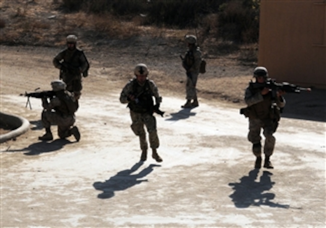 U.S. Marines from Echo Company, 2nd Battalion, 1st Marine Division move from point to point during an urban warfare training session as part of an exercise in the simulated town, known as combat town, at Camp Pendleton, Calif., on Aug. 12, 2008.  