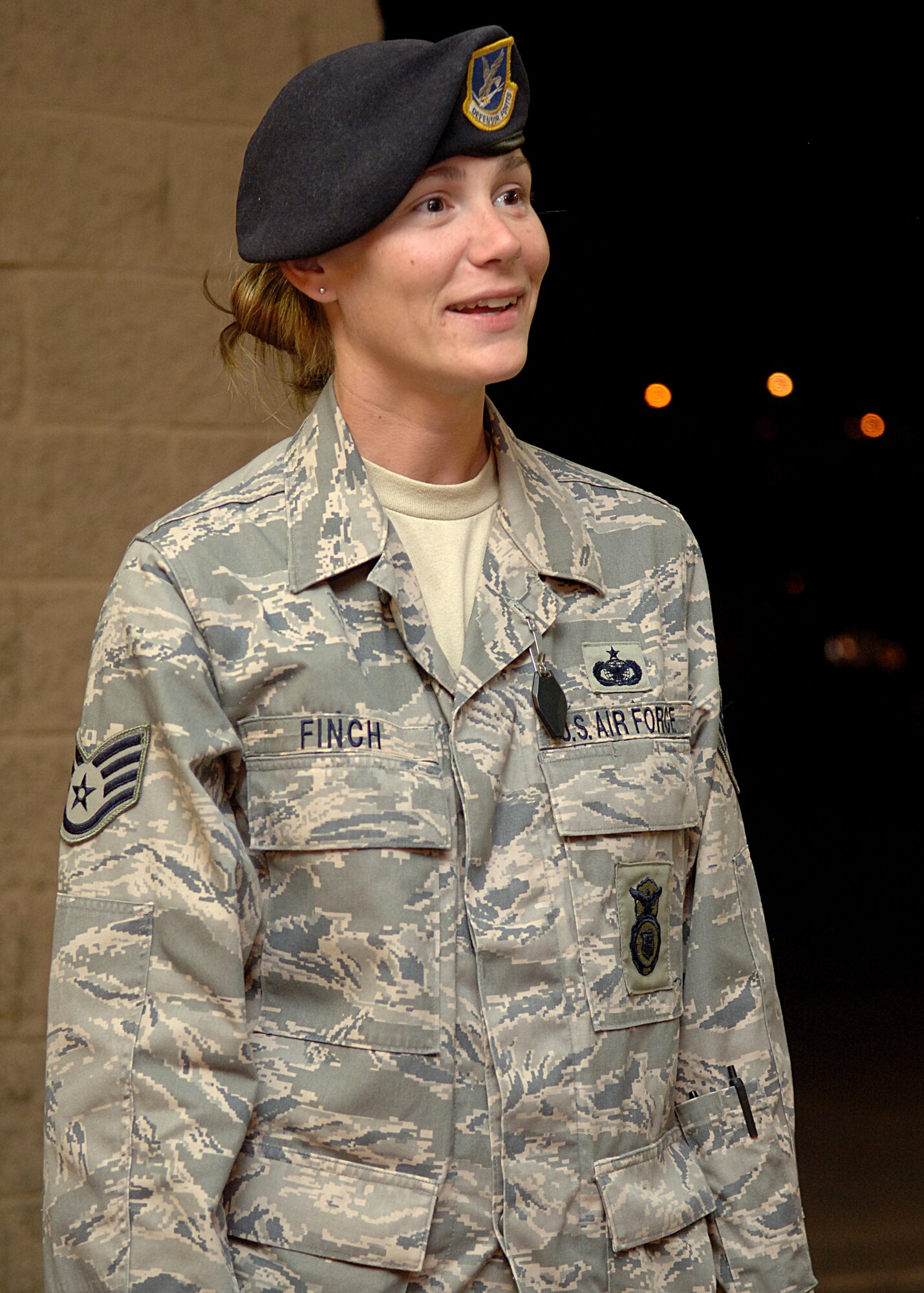 Staff Sgt. Stephanie Finch, 49th Security Forces Squadron, converses with members of her squadron Aug. 16 at Holloman Air Force Base, N.M.  Sergeant Finch returned from a six month deployment to Kirkuk with her K-9 Ate.  (U.S. Air Force Photo by A1C John D. Strong II)
