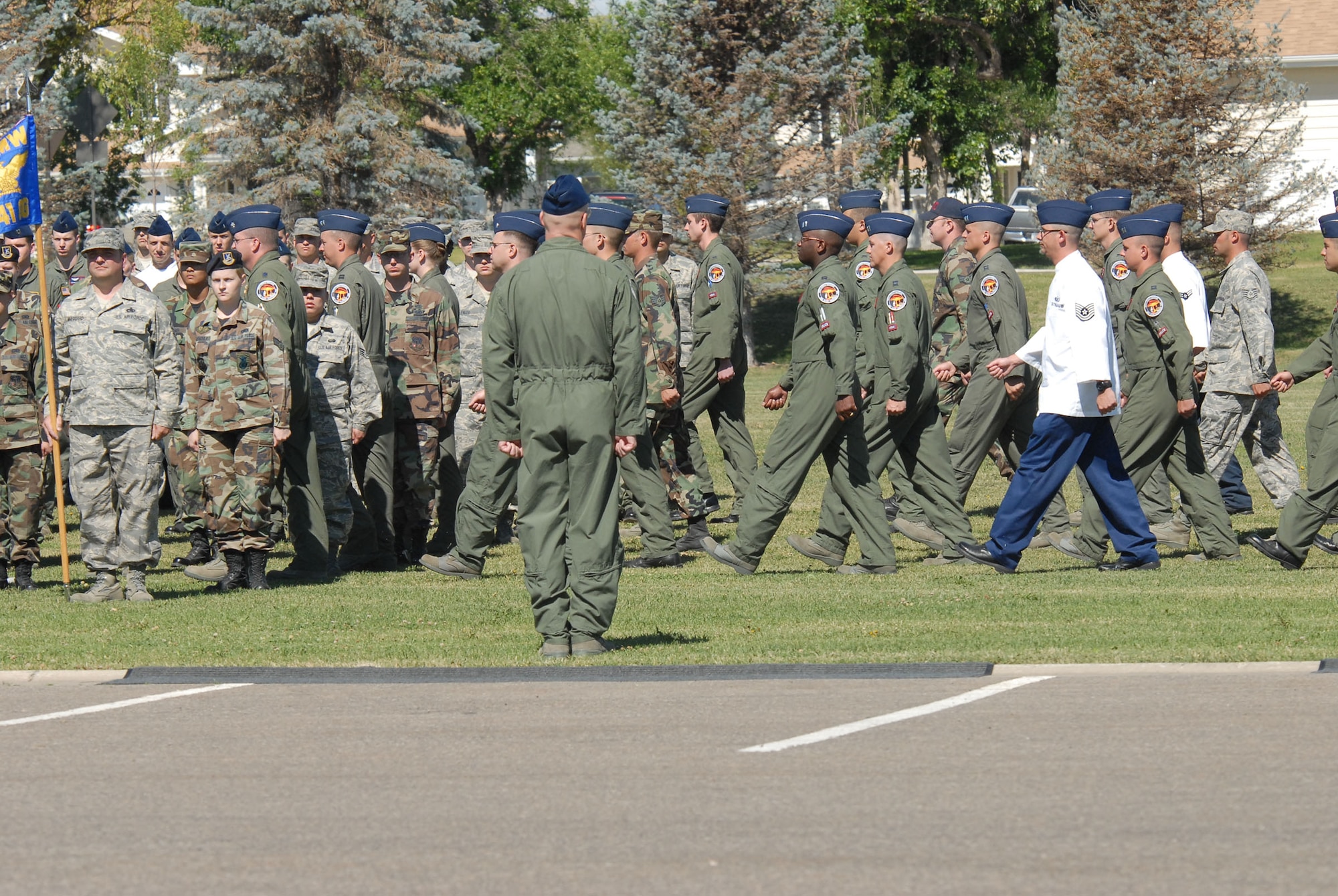 The remaining members of the 564th Missile Squadron march to merge with the 341st Missile Wing formation to signify the official inactivation of the squadron and the integration of it's personnel into other positions in the wing.  (U.S. Air Force photo/John Turner)