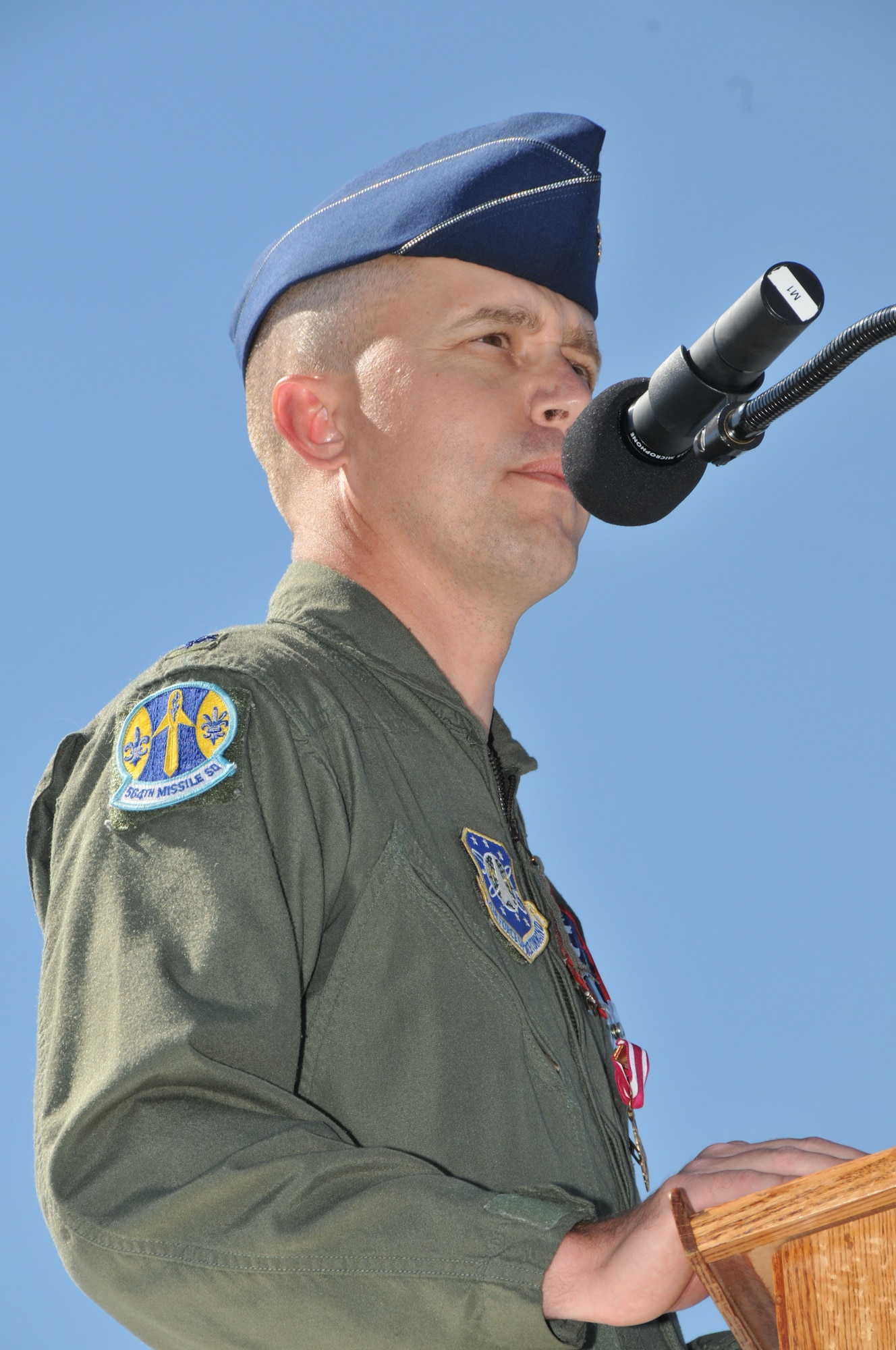 Lt. Col. Wayne Shaw, 564th Missile Squadron commander, addresses members of his squadron for the final time during the inactivation ceremony Aug. 15. He is moving on to 20th Air Force at F.E. Warren AFB, Wyo., while many of his team will move into one of the other three missile squadrons here. (U.S. Air Force photo/John Turner)