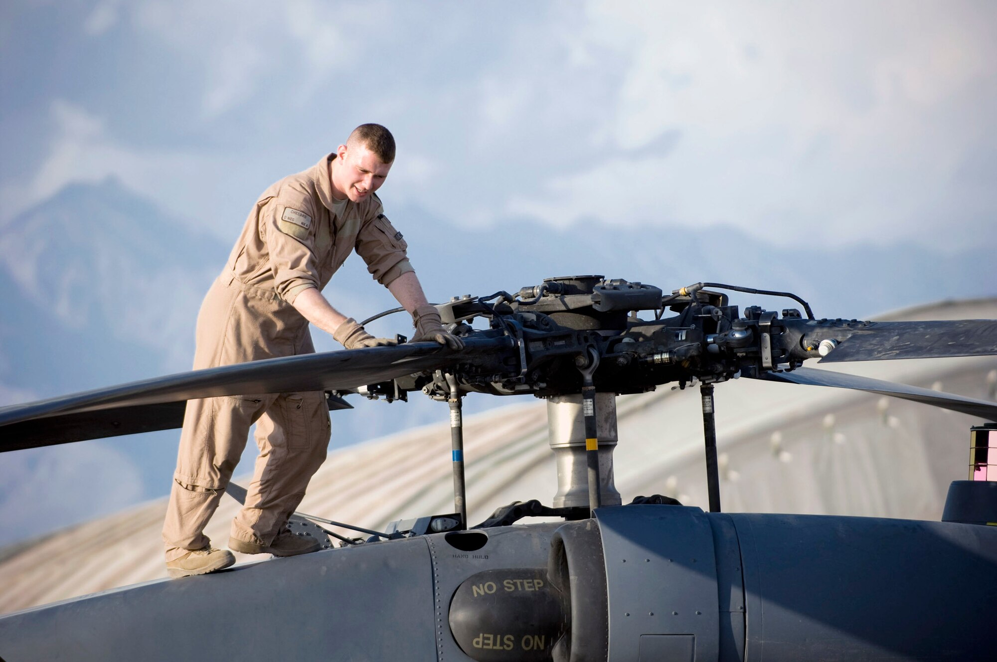 Airman 1st Class Devin Chesbro, a 33rd Expeditionary Rescue Squadron flight engineer, checks the main rotor on an HH-60G Pave Hawk Aug. 2 at Bagram Air Base, Afghanistan. Preflight checks such as these help to minimize the occurrences of in-flight emergencies. Airman Chesbro is deployed from the 33rd Rescue Squadron at Kadena AB, Japan. (U.S. Air Force photo/Staff Sgt. Samuel Morse)