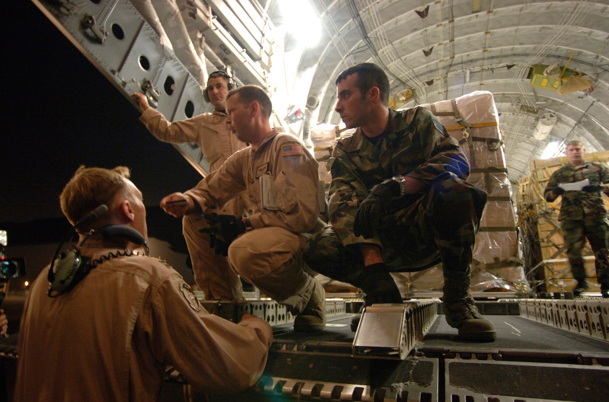 TBILISI, Republic of Georgia ? Team Dover aircrew members from the 3rd Airlift Squadron flew the first C-17 carrying humanitarian aid into the Republic of Georgia Aug. 13. Seven members of Team Dover made up the aircrew who flew a McGuire Air Force Base, N.J., C-17 from Ramstein Air Base, Germany, into Georgia. (U.S. Air Force photo/Master Sgt. Scott Wager)