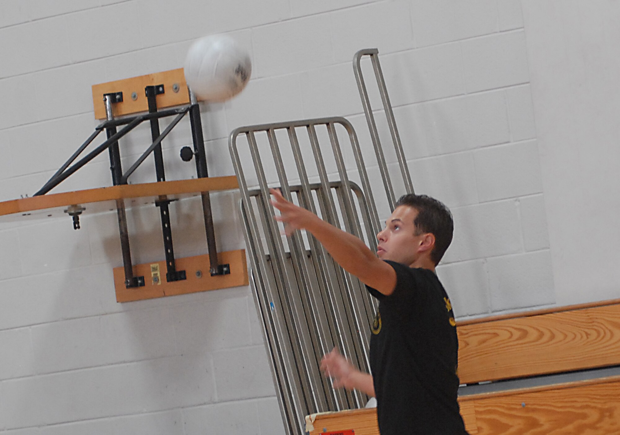 Bradley Wiskowski serves for ALS to the Chiefs and Shirts during a volleyball game on base Aug. 18. The Chiefs and Shirts team beat ALS 2-1. Wiskowski is with ALS from the 128th Civil Engineer Squadron, Wisconsin Air National Guard. (U.S. Air Force photo/Airman 1st Class Melissa White)