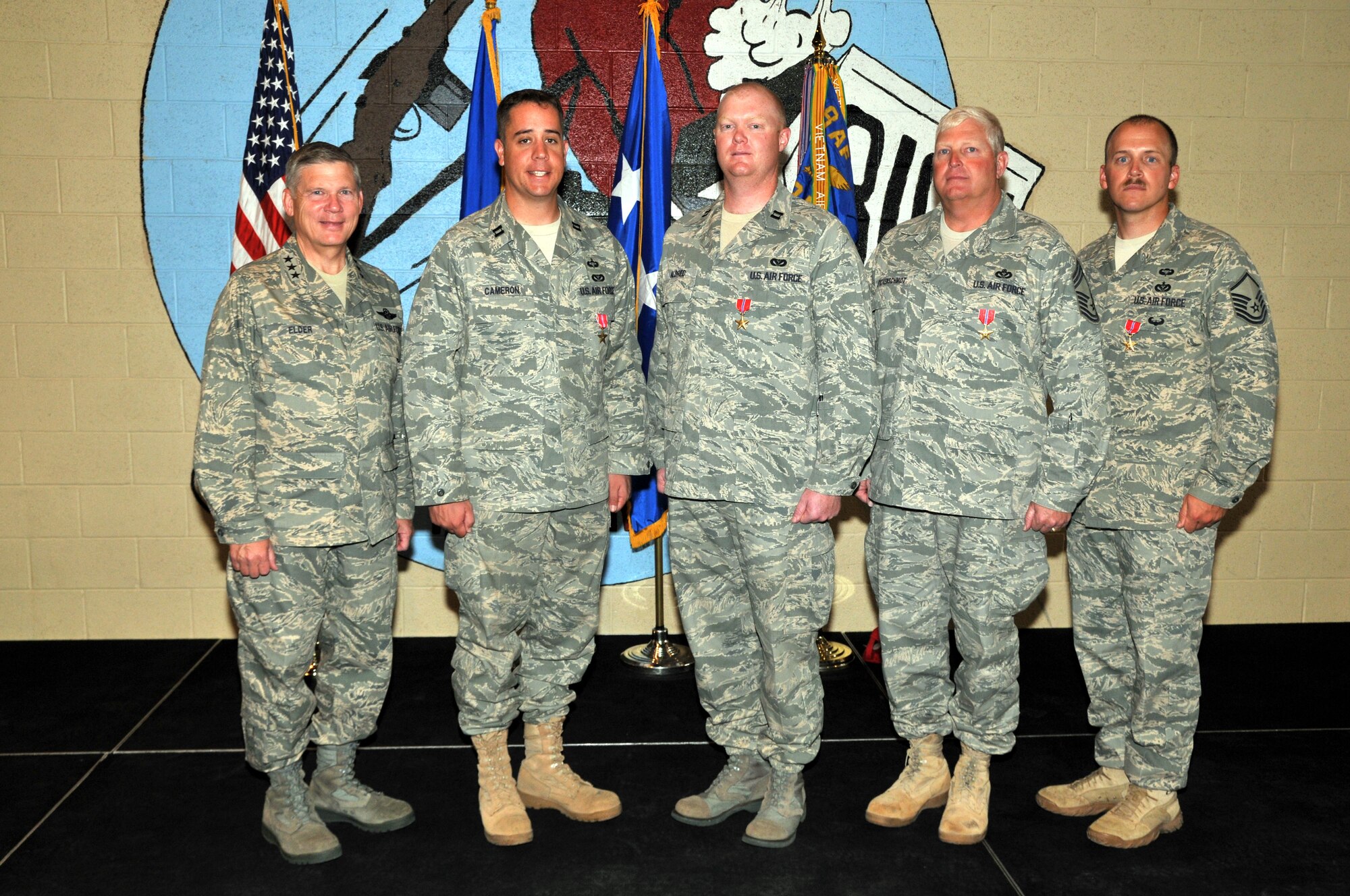 Lt. Gen. Robert Elder, Eighth Air Force (Air Forces Strategic) commander, poses with the four members of the 819th RED HORSE Squadron after presenting them with Bronze Star Medals for their recent service while deployed to Iraq and Afghanistan. Pictured left to right with the general are Capt. Glenn Cameron, Capt Josh Aldred, Chief Master Sgt. Gary Stuckenschmidt and Master Sgt. Todd Pederson. (U.S. Air Force photo/John Turner)