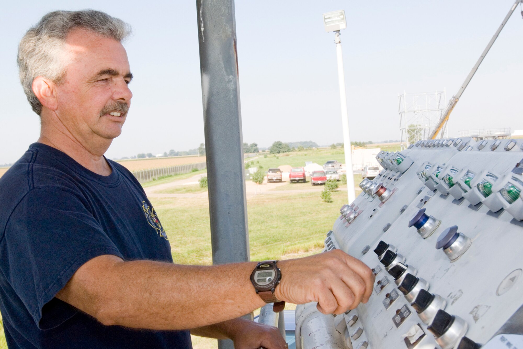 GRISSOM AIR RESERE BASE, Ind., -- Bill Dixon, from the Grissom Fire Department, controls the release of propane into the fire training area. The propane is pumped into a simulated aircraft allowing fire fighters an opportunity for more realistic training. (U.S. Air Force photo/Tech. Sgt. Doug Hays)