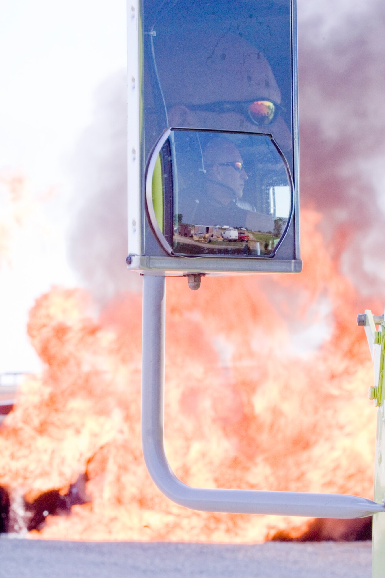 GRISSOM AIR RESERVE BASE, Ind., -- Wayne Pikalek, a member of the Grissom Fire Department, acts  as a safety overwatch during a recent demonstration at the base fire training area. Various demonstrations and training activities were conducted recently as a way to increase awareness of the fire department among base employees.  (U.S. Air Force photo/Tech. Sgt. Doug Hays)