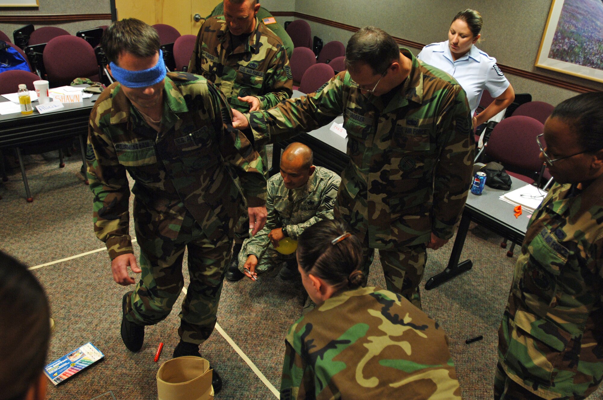 Tech. Sgt. Shawn Birmingham receives verbal guidance for getting through a simulated mine field while blindfolded.; The team-building exercise was part of a two-week Noncommissioned Officer Leadership Development course that Sergeant Birmingham and 20 other Airmen from the 931st Air Refueling Group completed on Aug. 15. Sergeant Birmingham is assigned to the 931st Aircraft Maintenance Squadron. (U.S. Air Force photo/Tech. Sgt. Jason Schaap)