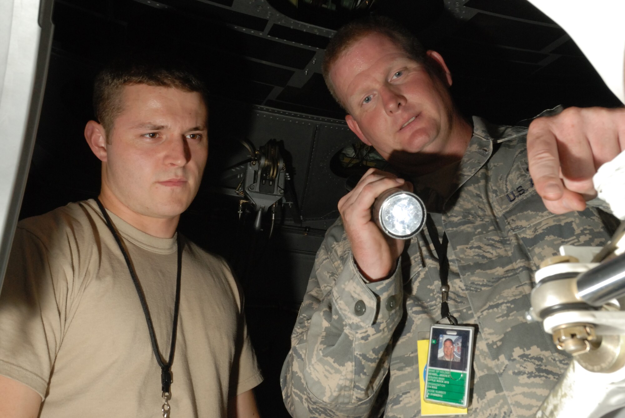 LITTLE ROCK AIR FORCE BASE, Ark.--Tech. Sgt Jason Hensel, 314th Maintenance Group instructs Senior Amn Derek Webb, 314th Maintenance Squadron, about  on the flightline on July 3, 2008.  AB Tapps signs off on installing a new intake into a C-130 engine. (U.S. Air Force photo by Senior Airman Christine Clark)(Released)