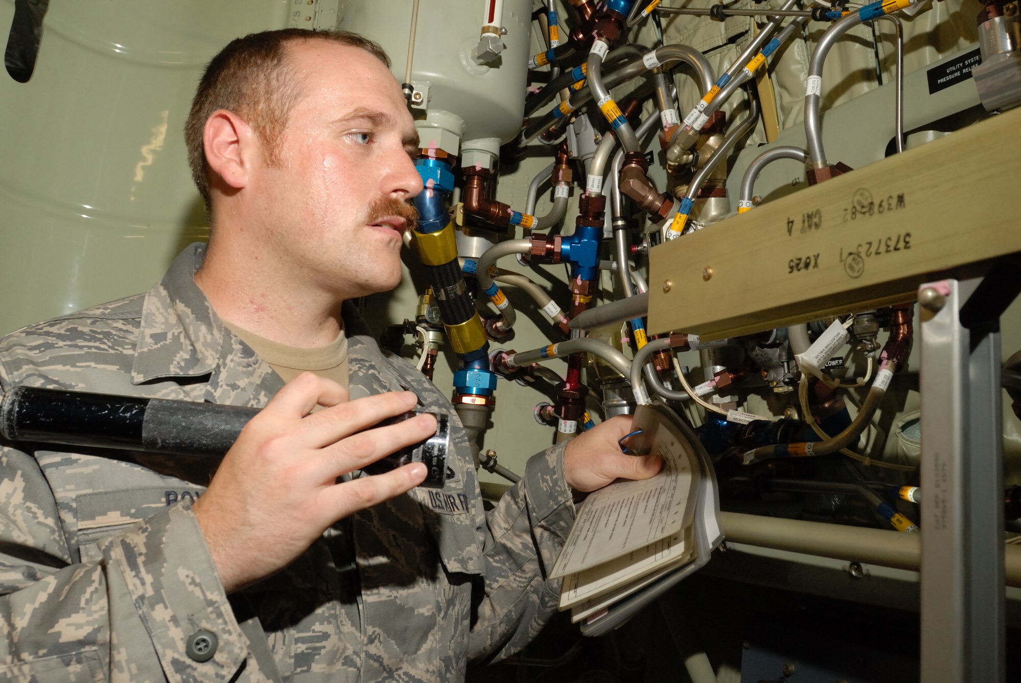 LITTLE ROCK AIR FORCE BASE, Ark.--Tech. Sgt. Jeremy Boyd, 314th Maintenance Group, inspects  the hydraulics on C-130 on the flightline July 29.  Sergeant Boyd is the hydraulics inspector specialist for his team of Quality Assurance. (U.S. Air Force photo by Senior Airman Christine Clark)(Released)