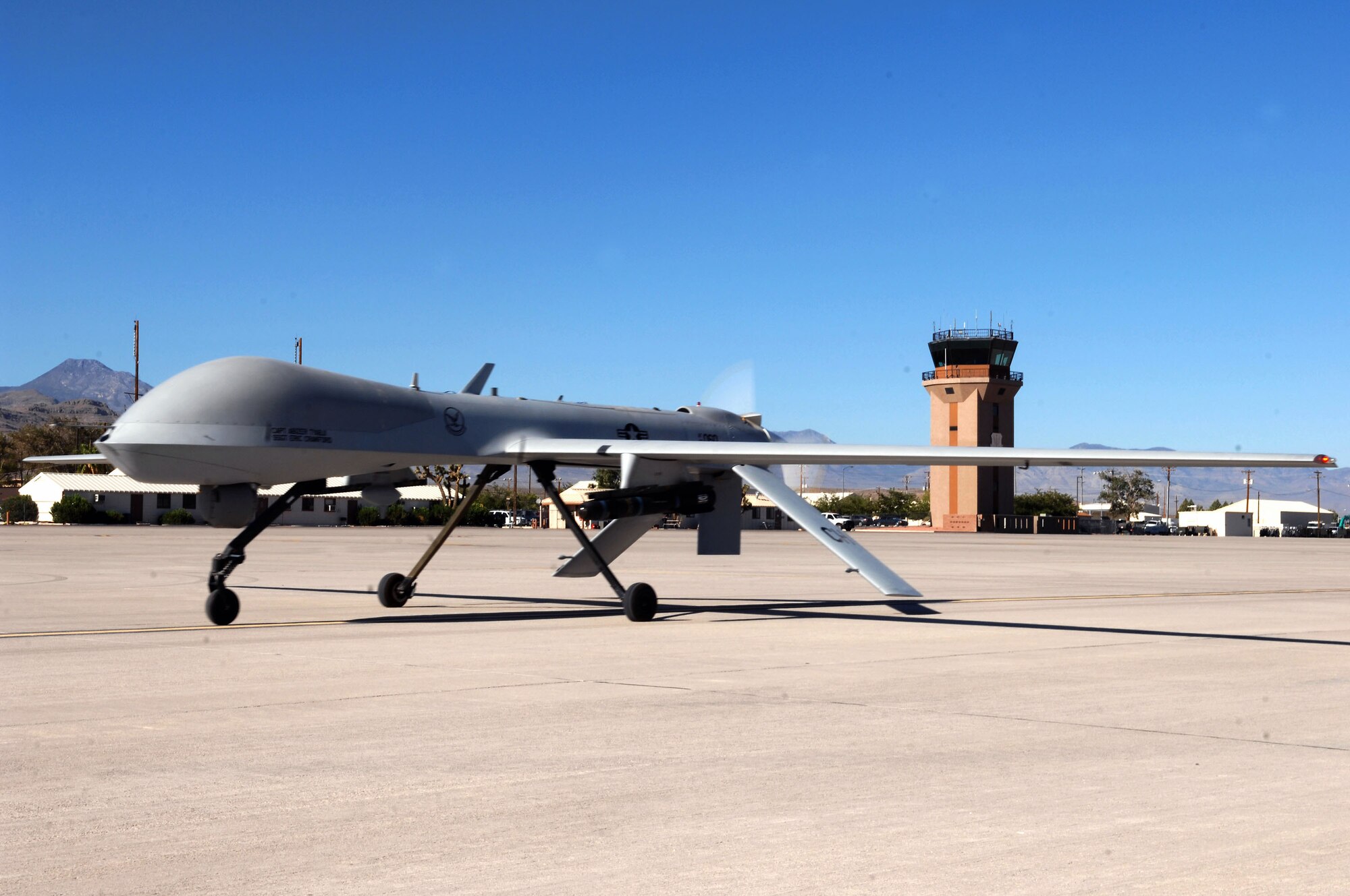 An MQ-1 Predator unmanned aircraft system taxies down a runway Aug. 13 at Creech Air Force Base, Nev. The Predator recently passed 400,000 flight hours during missions over Iraq and Afghanistan. (U.S. Air Force photo/Senior Airman Larry E. Reid Jr.) 
