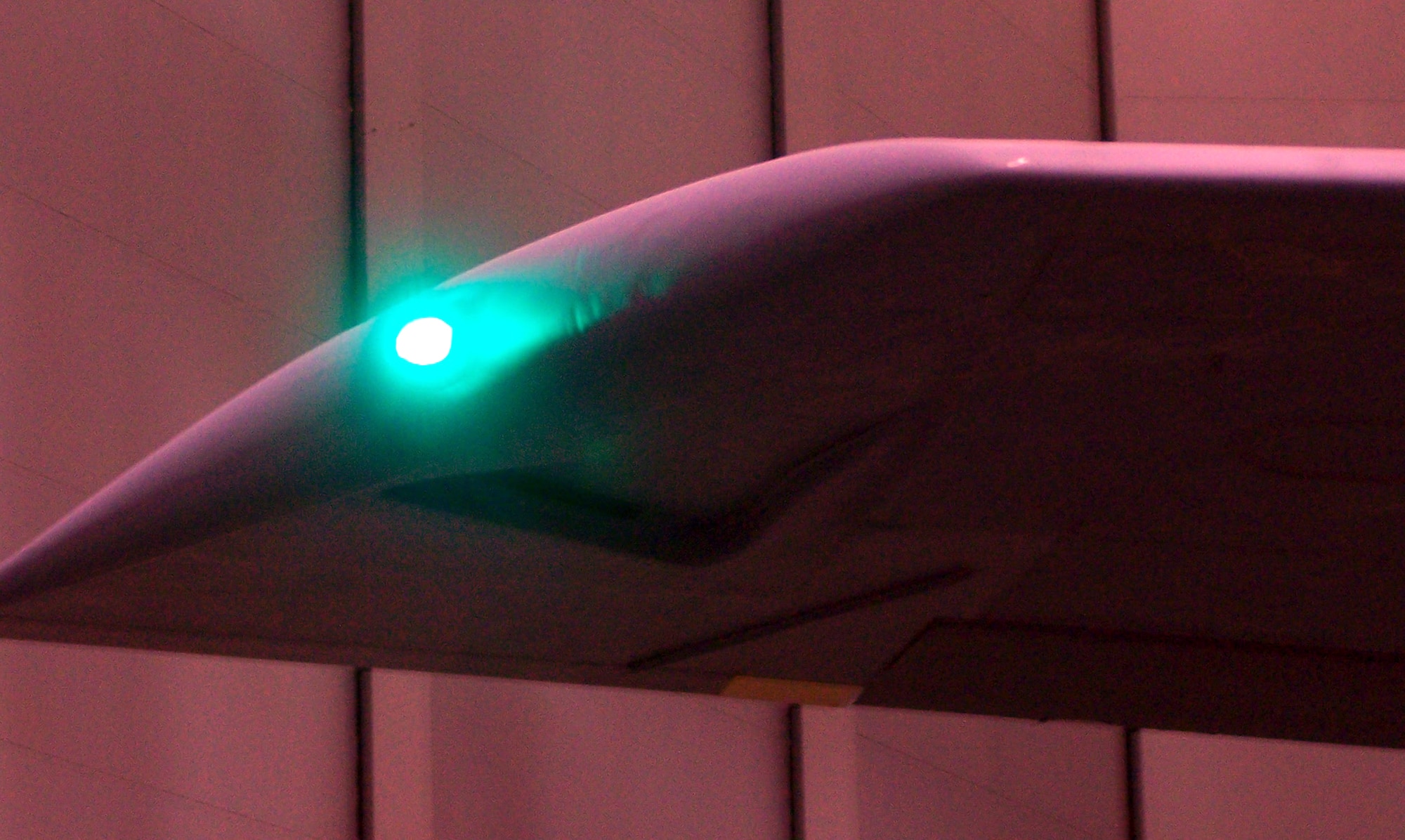 This view of a special covering of a KC-135R Stratotanker wingtip light shows the specialized lighting cover designed to be seen through night vision goggles as part of the demonstration at Phoenix Sky International Airport, Ariz., for the Air Mobility Battlelab's KC-135 Exterior Night Vision Imaging System-compatible Lighting initiative Aug. 23, 2007.  The initiative has been recommended by the AMB for fielding by Air Mobility Command.  (U.S. Air Force Photo)