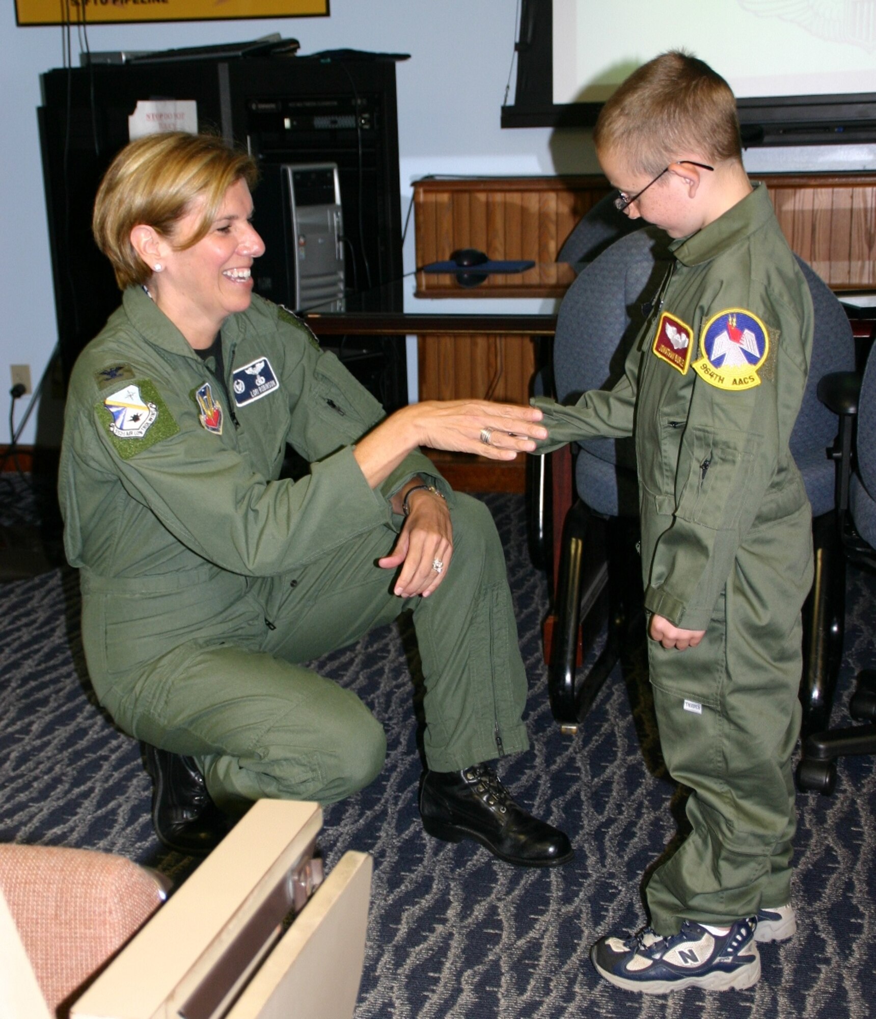 General Robinson presented the young "Pilot for a Day" star, Jonathan Burley with a wing coin. Photo courtesy of Staff Sgt. Stacy Fowler.