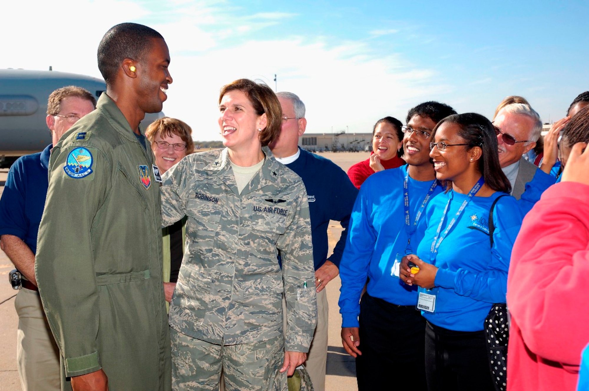 Brig. Gen. Robinson gives a pat on the back to Capt. Brian Hardeman after conducting a tour of the E-3 Sentry for local community leaders and outstanding high school students. Photo compliments of David Faytinger.