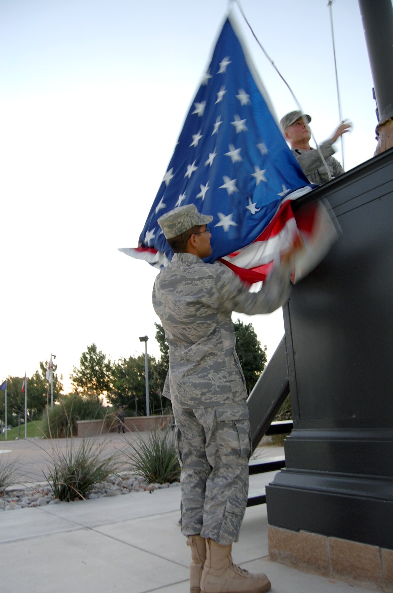 LAUGHLIN AIR FORCE BASE, Texas – First Term Airmen’s Center students perform reveille ceremonies here recently. Units and squadrons here will begin taking turns performing these honors every Thursday afternoon and Friday morning at Heritage Park. While each unit will only be performing the honors about two times each year, all base members are welcome to attend the ceremonies every week. (U.S. Air Force photo by Airman 1st Class Sara Csurilla) 