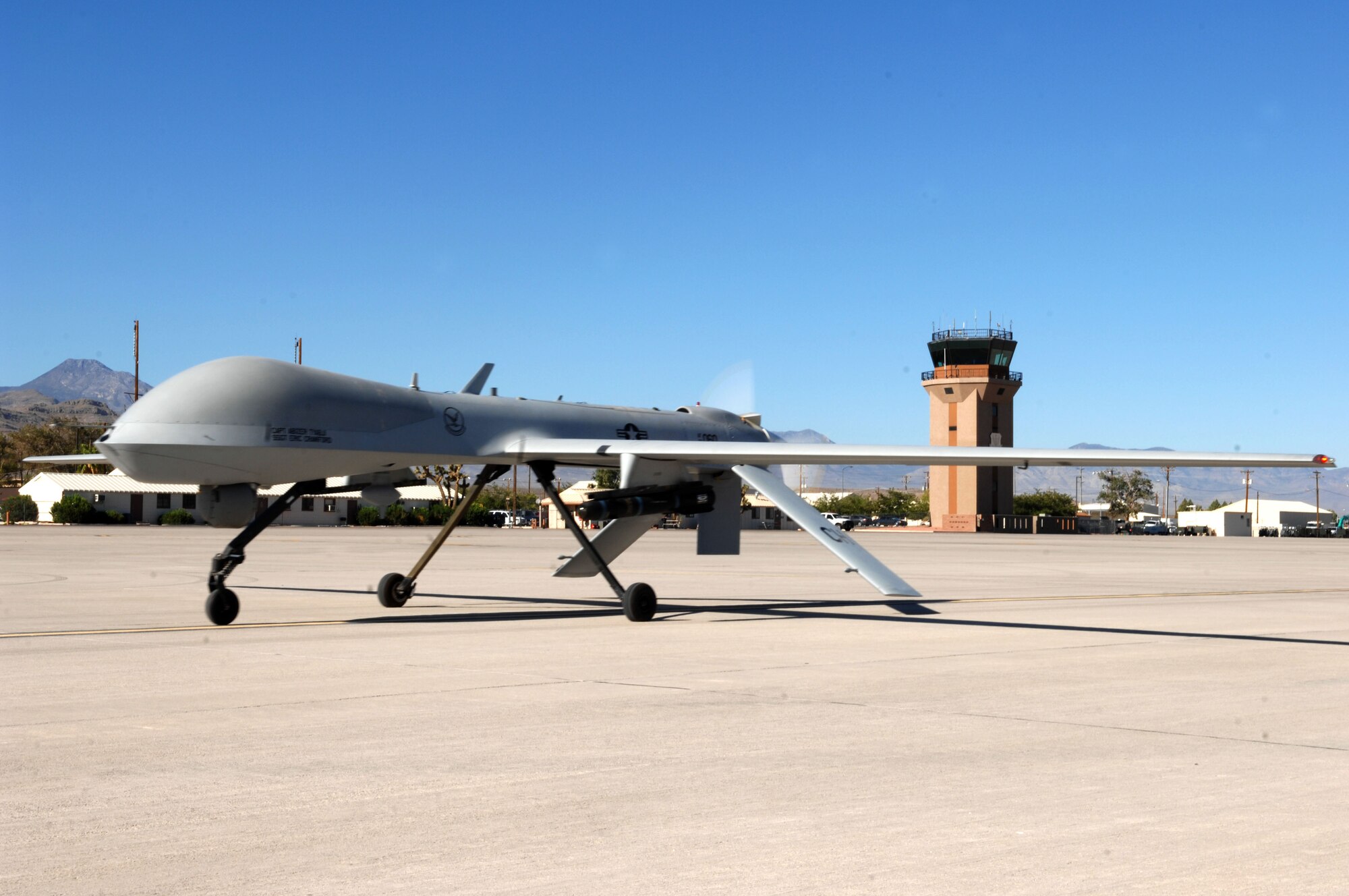 An MQ-1 Predator unmanned aircraft system taxies down a runway at Creech AFB, Nev., Aug. 13. The MQ-1 Predator recently passed 400,000 flight hours during missions over Iraq and Afghanistan. (U.S. Air Force photo by Senior Airman Larry Reid)