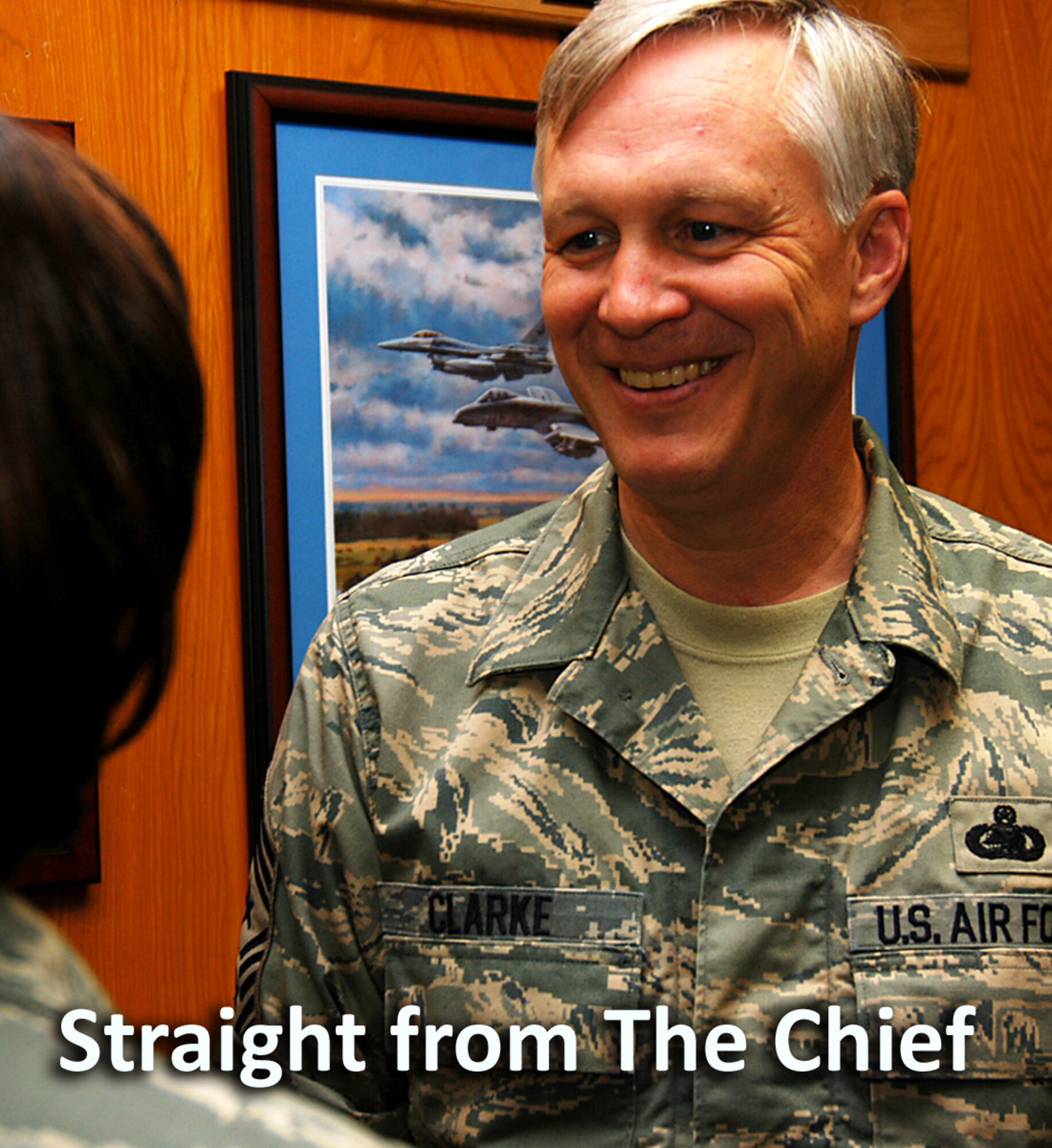 Air Force Recruiting Service Command Chief Master Sgt. Vance Clarke and Master Sgt. Bellamy discuss schedules Aug. 15. Chief Clarke joined the Air Force recruiting team in May. (U.S. Air Force photo illustration/Staff Sgt. Jennifer Lindsey)