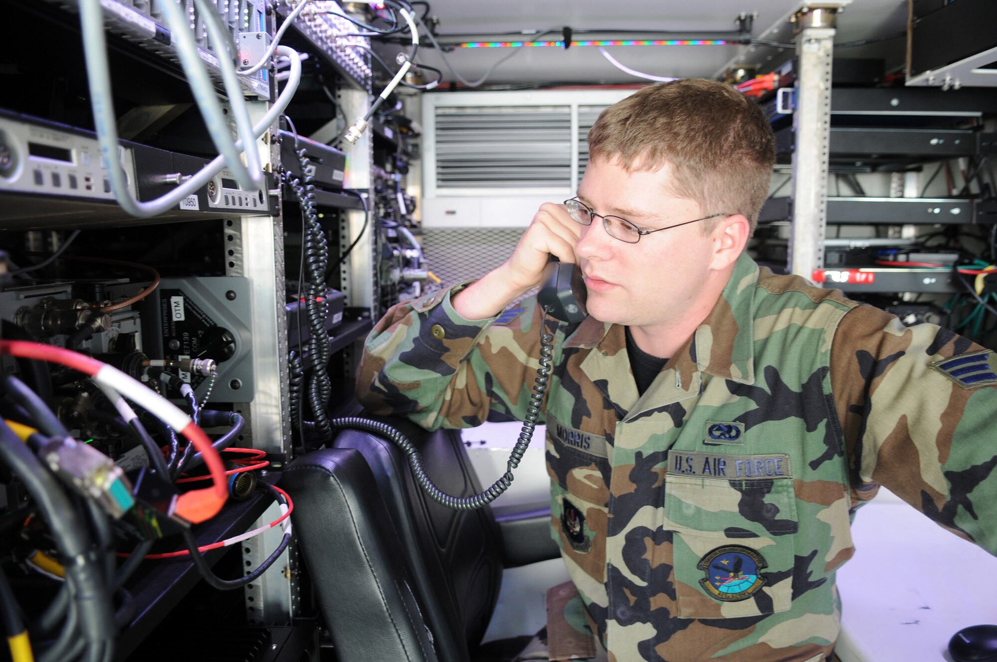 Senior Airman Keith Morris, 603rd Air and Space Communication Squadron ground radio maintenance technician, tests the telephone in the ground mobile gateway Ramstein Air Base, Germany, Aug. 18, 2008. The ground mobile gateway is used as a communication device for the E-3 Sentry airborne warning and control system aircraft. (U.S. Air Force photo by Senior Airman Kelly LeGuillon)(Released)*