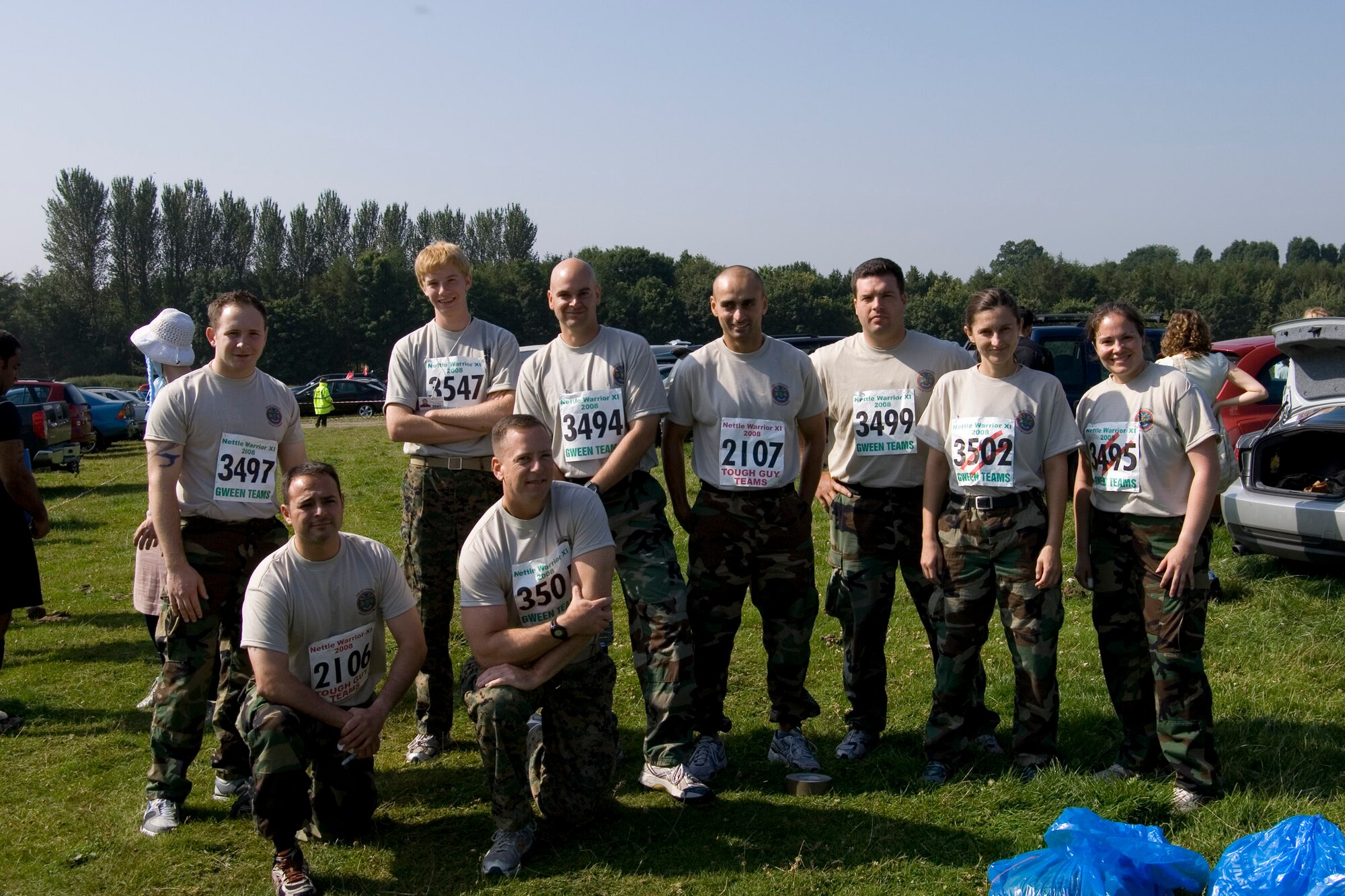 The JAC-HAMMERS Team for the Tough Guy Nettle Warrior 2008 Competition:  (L-R) Kneeling:  Navy Lt. Jose Lepesuastegui, Marine Corps Col. Pete Devlin; Standing Navy Petty Oficer Third Class Joseph Libbard. Anthony Devlin, Navy Lieutenant Commander J. Wayne Hill, Lt. John Rahaghi, Chief Petty Officer Nick Williams, Ms. Ivana Young and Navy Lt. Katie Hall.  (U.S. Air Force Photo by Staff Sgt. Chad E. Chisholm)