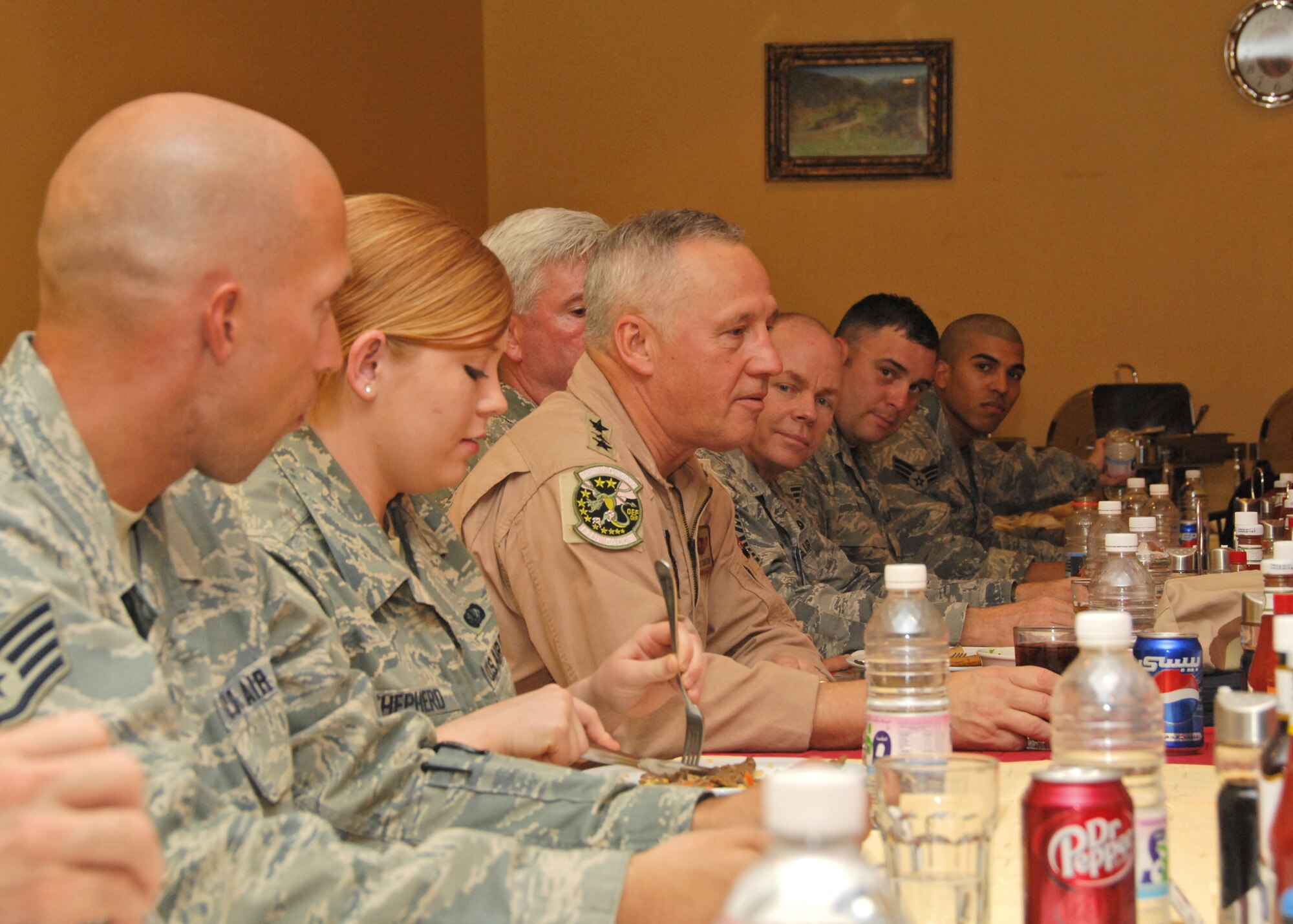 SOUTHWEST ASIA -- Gen. Bruce Carlson, commander of Air Force Materiel Command, meets with enlisted members of the 386th Air Expeditionary Wing to answer questions and discuss various issues affecting the Air Force on Aug. 18 at an air base in Southwest Asia. General Carlson met with members of the 386th Air Expeditionary Wing to see how AFMC can assist with current operations in the U.S. Central Command area of responsibility. (U.S. Air Force photo/Tech. Sgt. Raheem Moore)